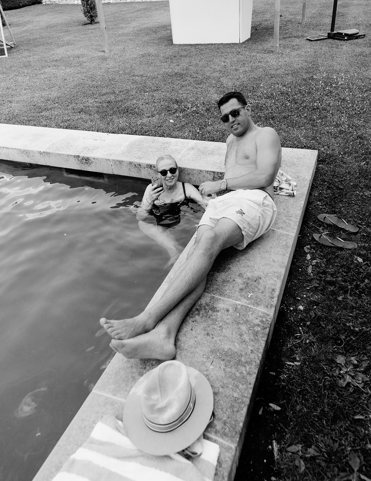 Relaxed guests in the pool during a day-after wedding party in France