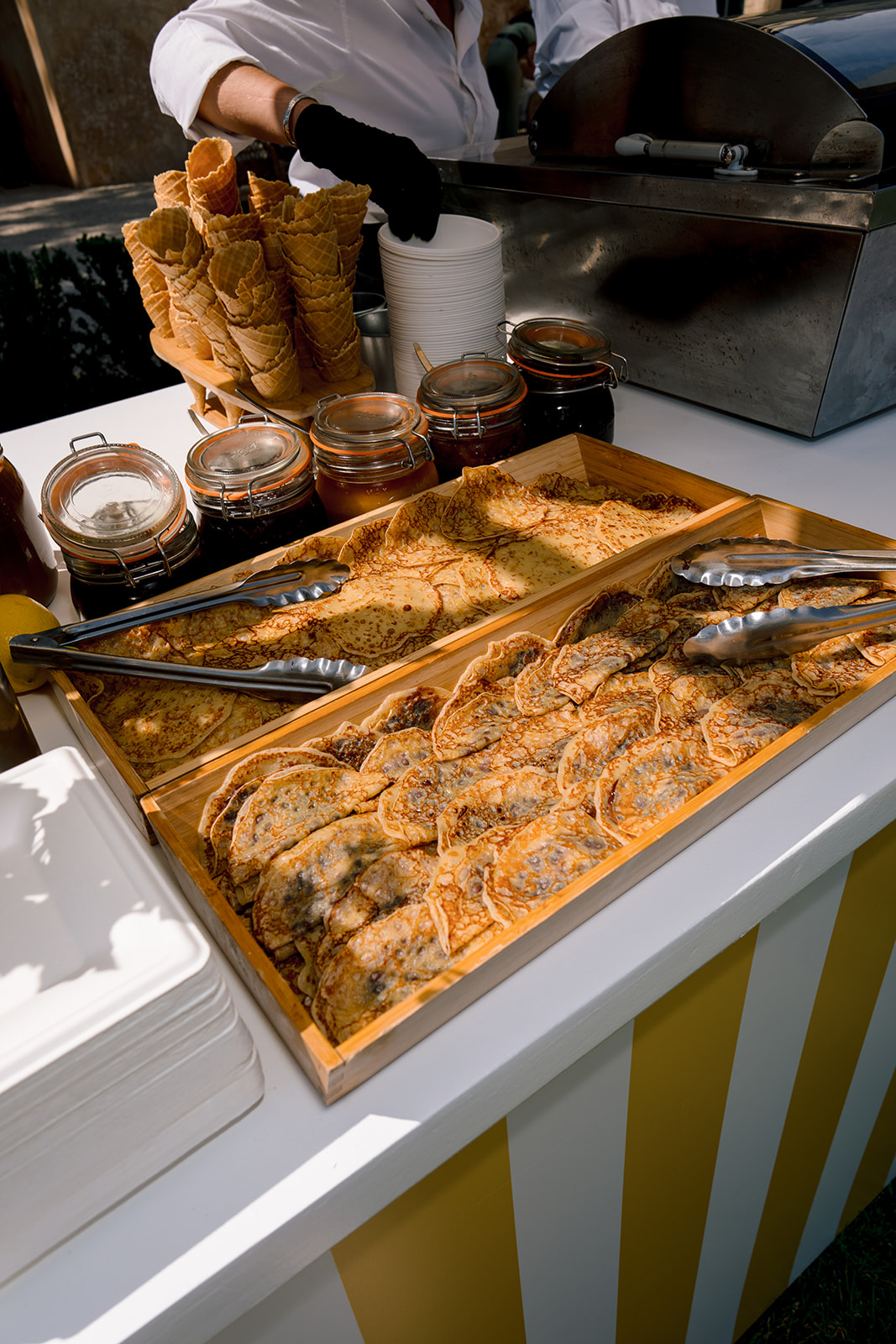Fresh French crepes served at an outdoor wedding food station in France