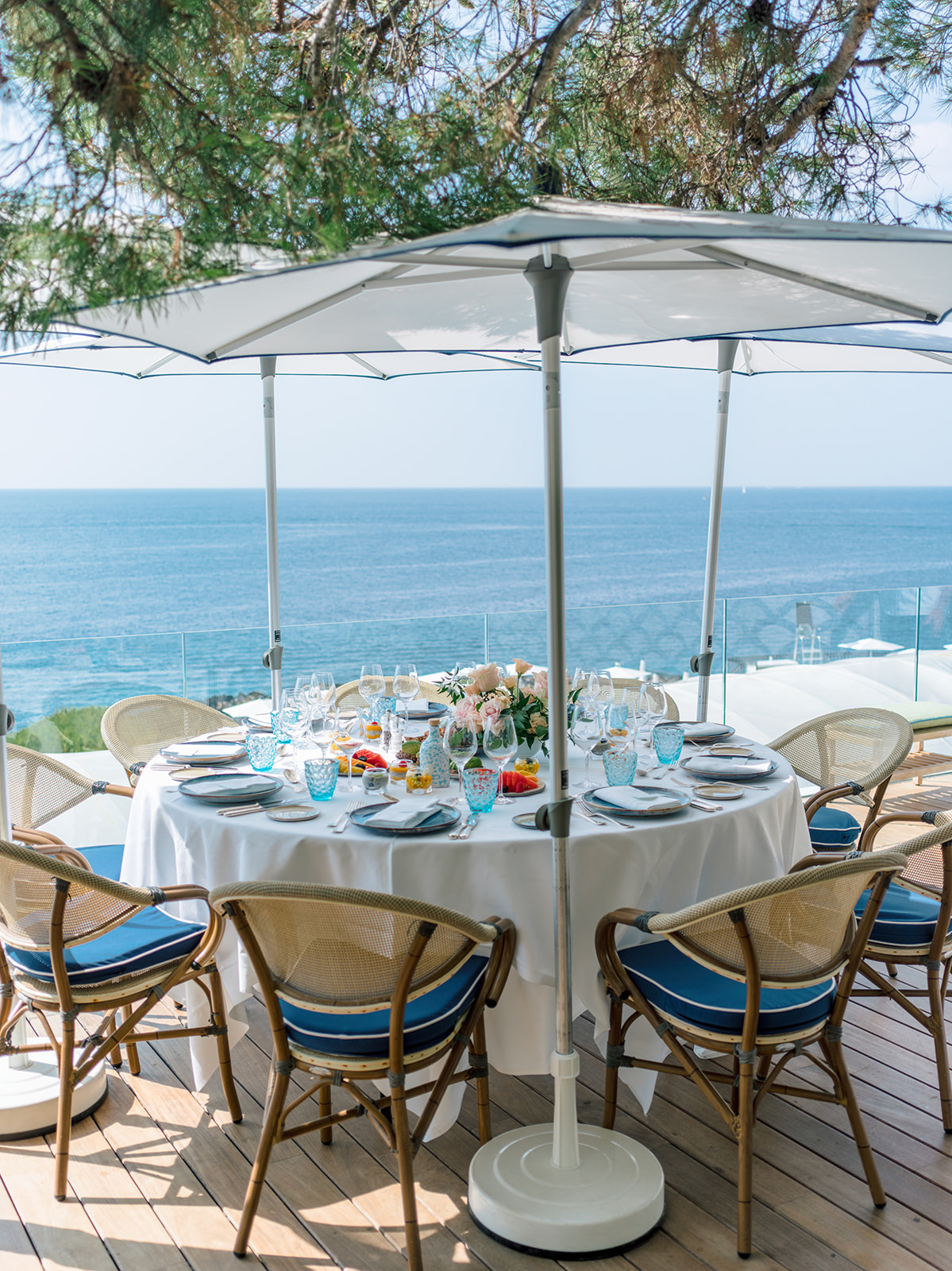 Sea-view terrace set for a wedding pool party lunch on the French Riviera