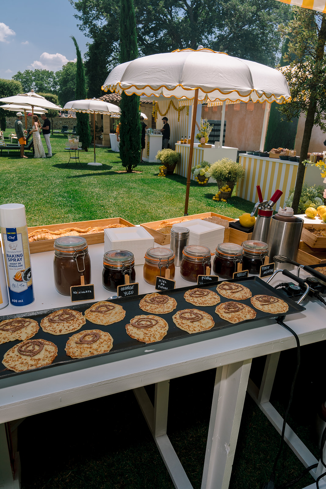 Live French crepe station at a destination wedding pool party in Provence