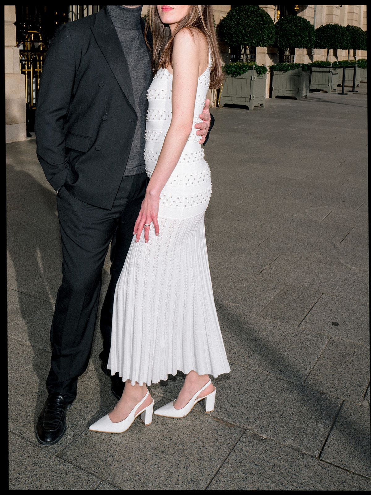 Fashion couple portrait photographed with direct flash outside the Ritz Paris