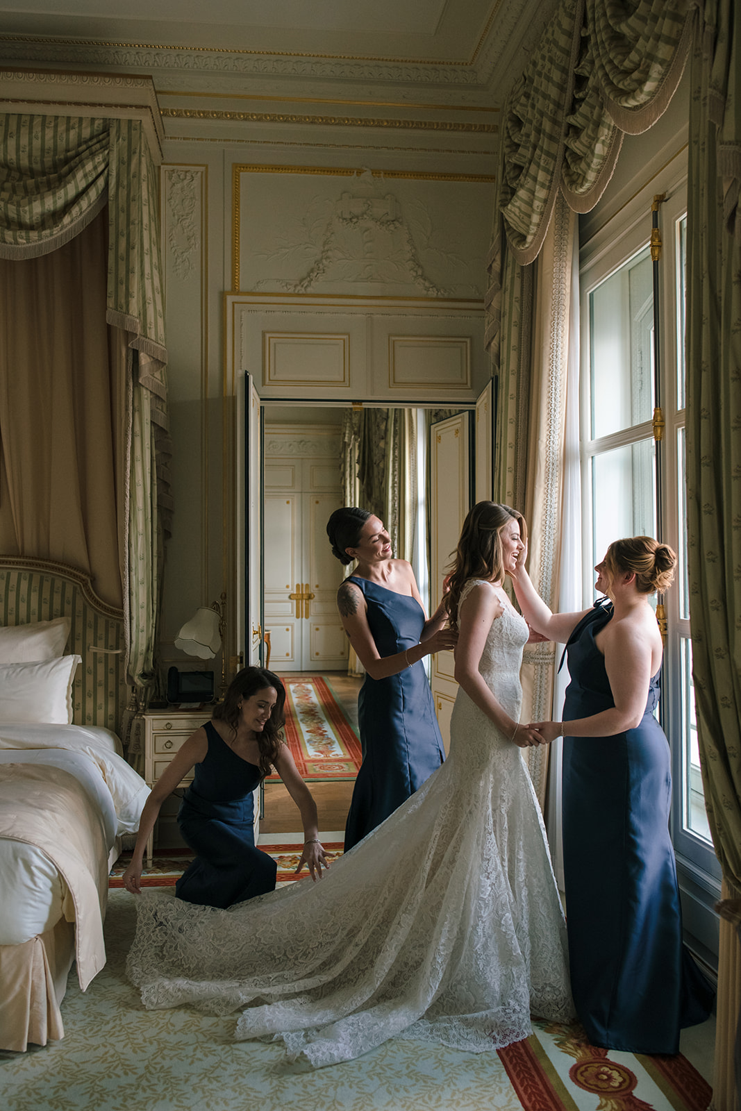 Editorial photograph of the bride and bridesmaids in a Ritz Paris suite