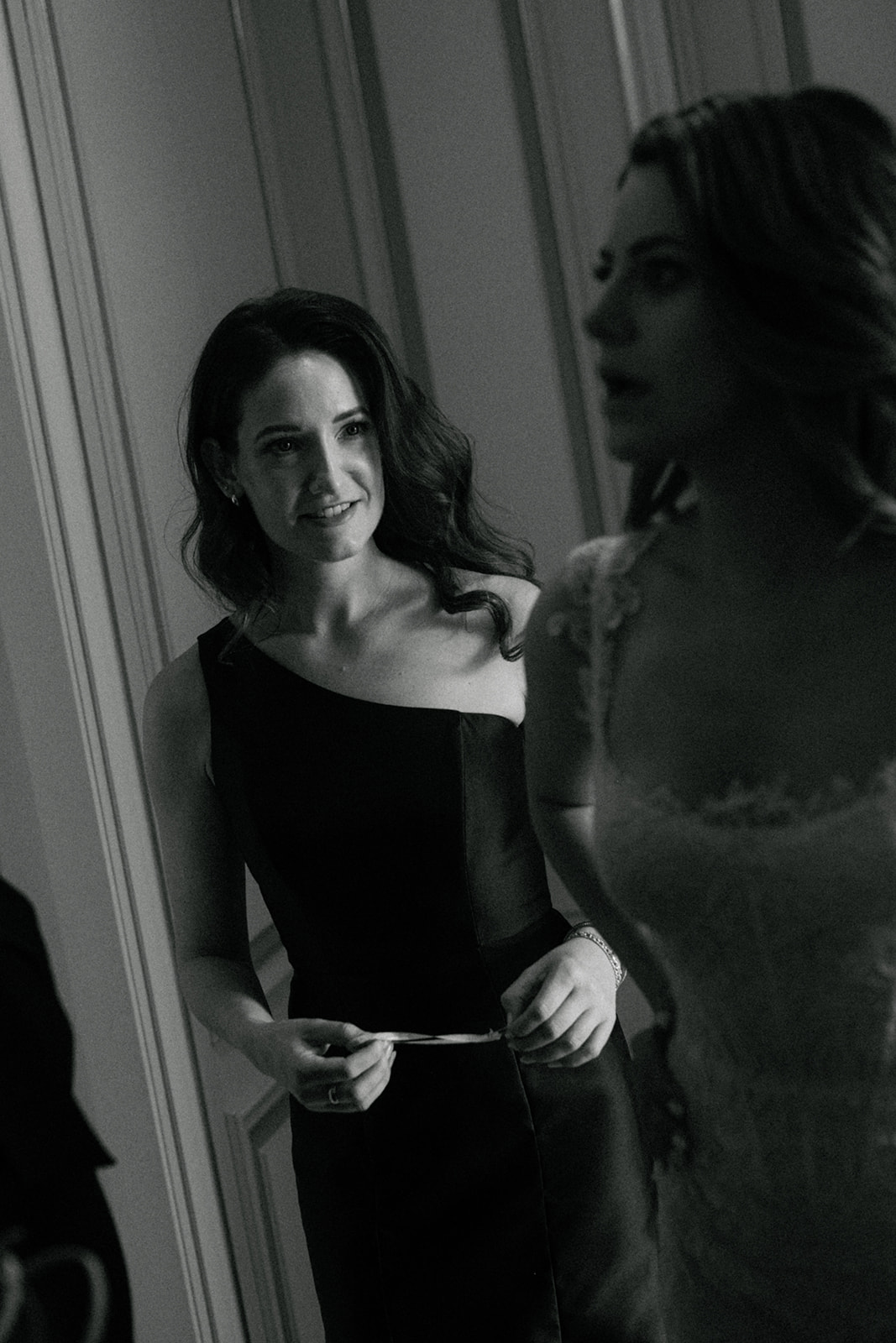 Bride sharing an intimate moment with friends during wedding morning at the Ritz Paris