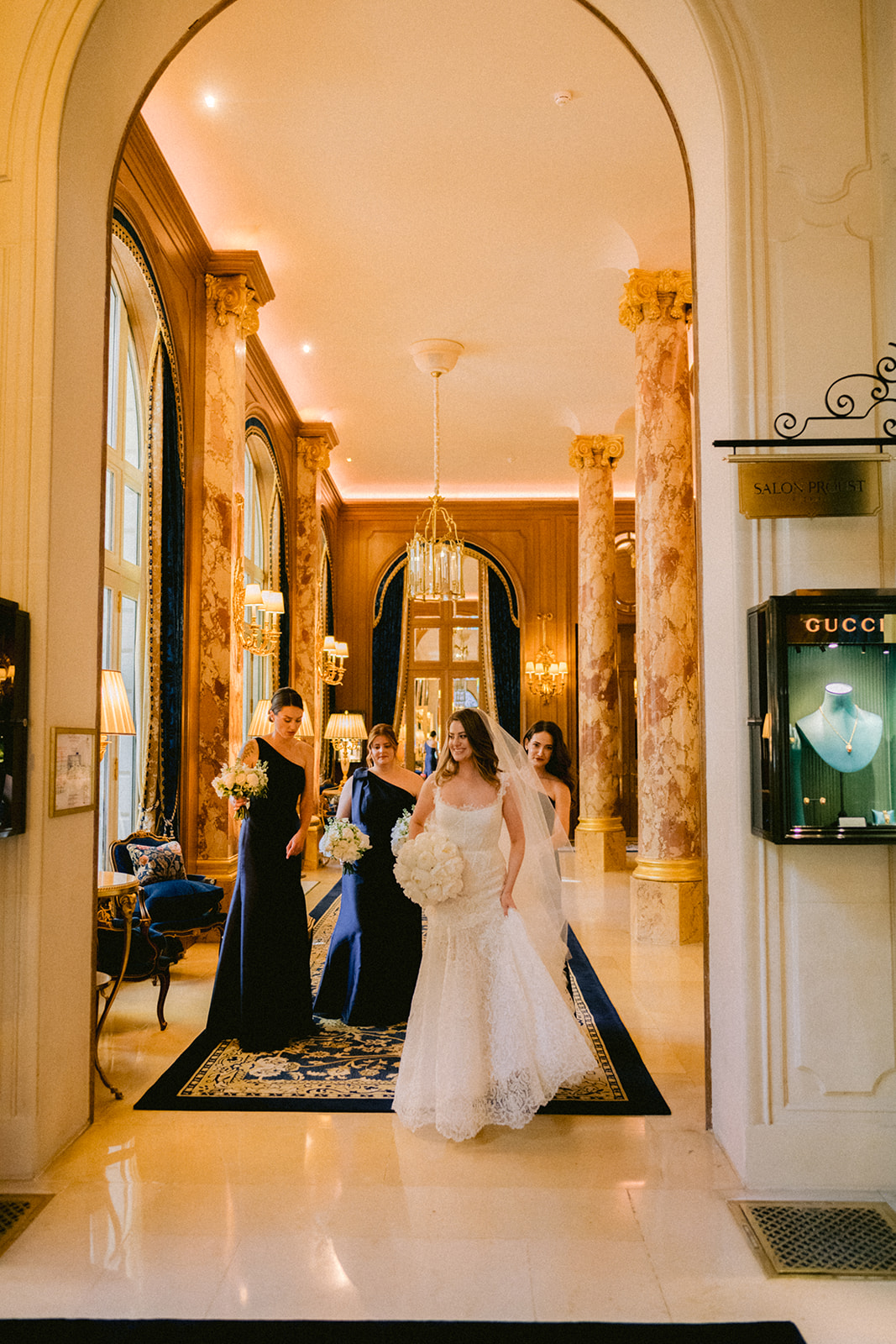Bride walking through a luxury Paris hotel before the wedding ceremony