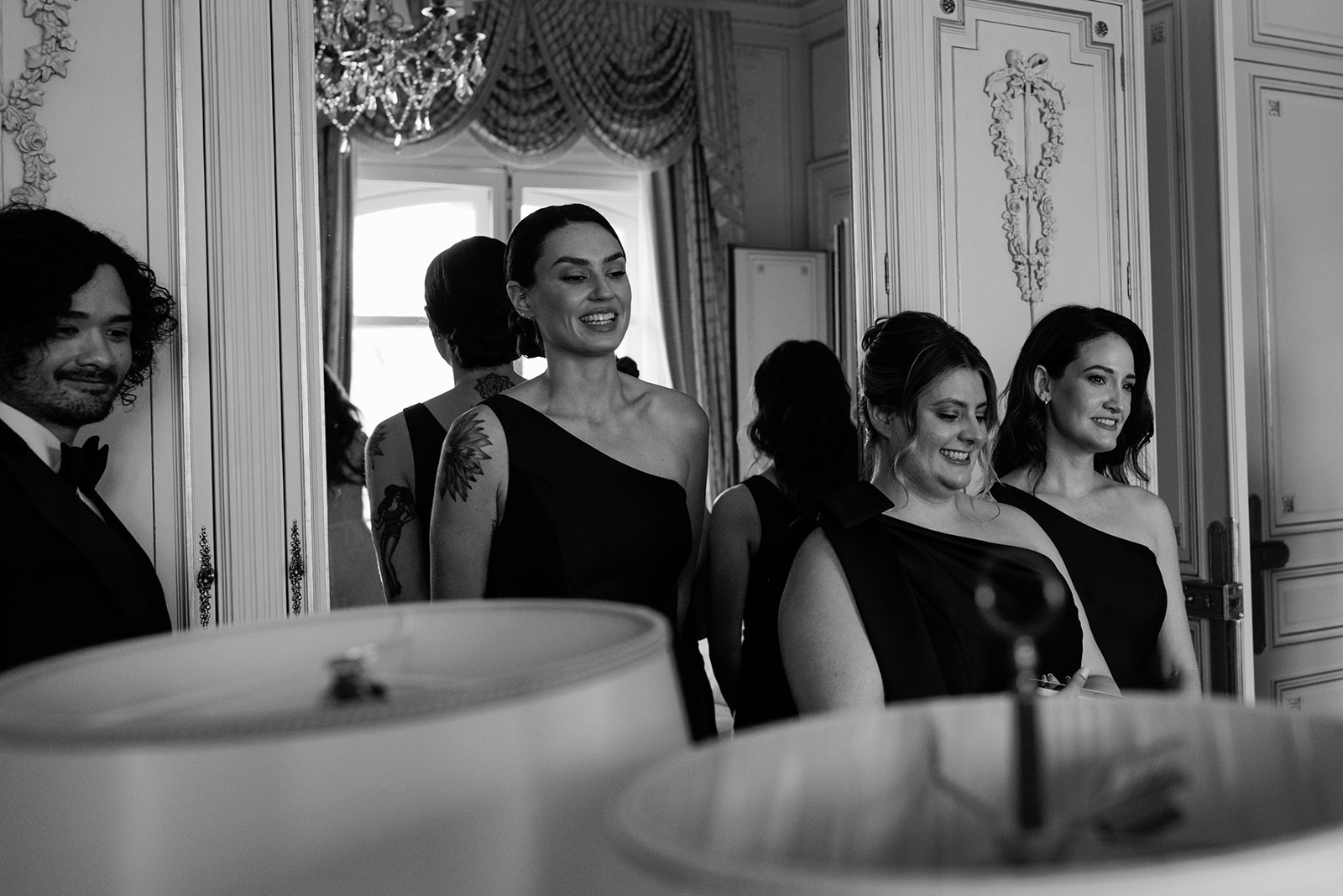 Bridesmaids laughing together during wedding morning at the Ritz Paris
