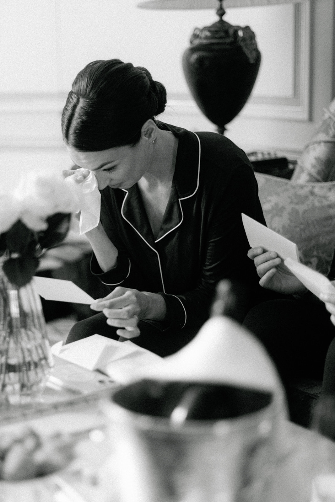Candid close-up of the groom preparing wedding details at the Ritz Paris