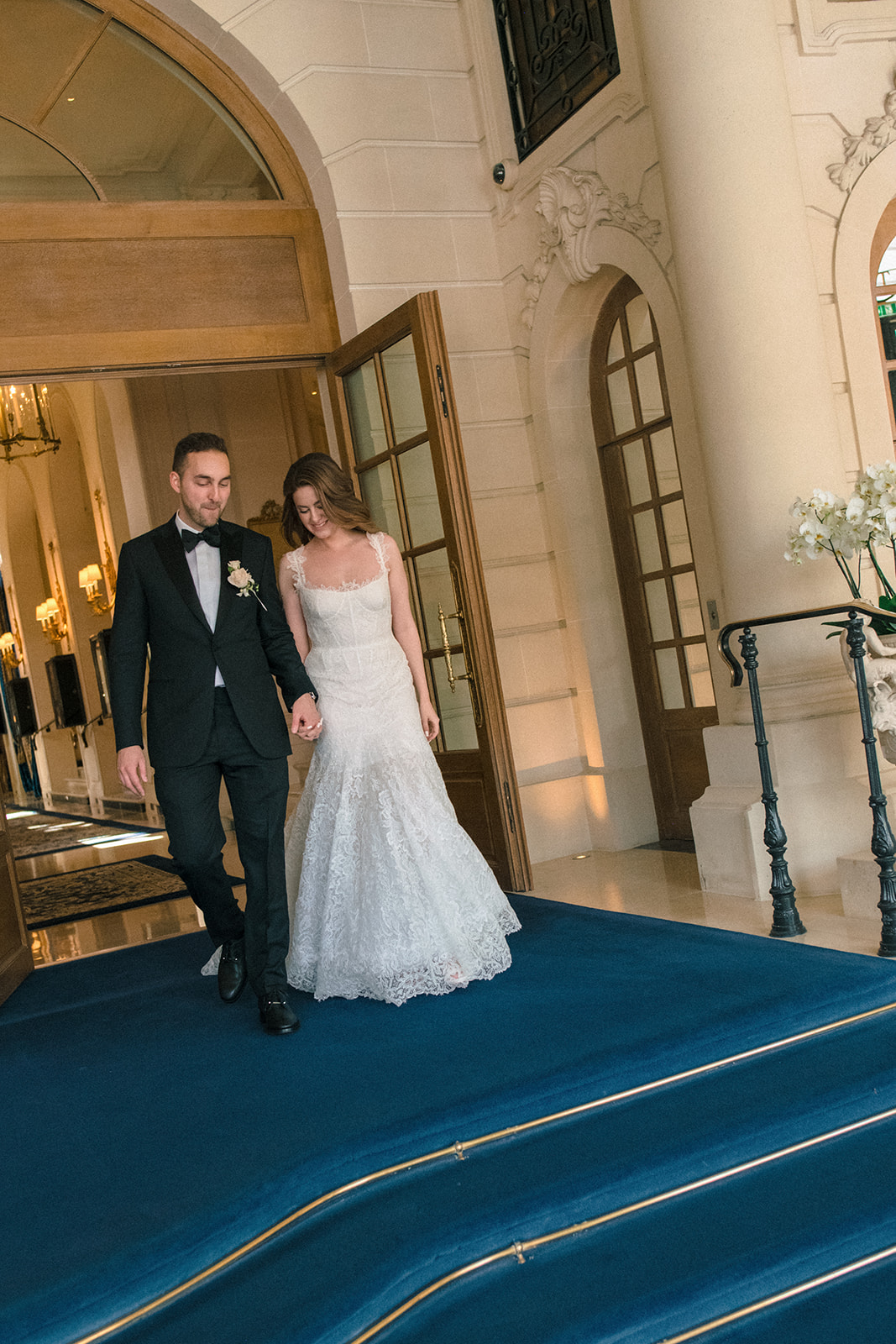 Newlyweds entering the Ritz Paris in an editorial wedding portrait