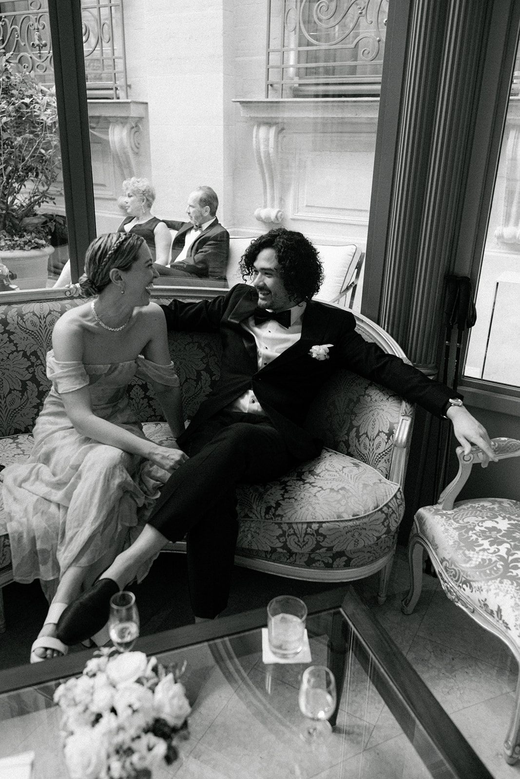 Wedding guests sharing a candid moment during the Ritz Paris reception