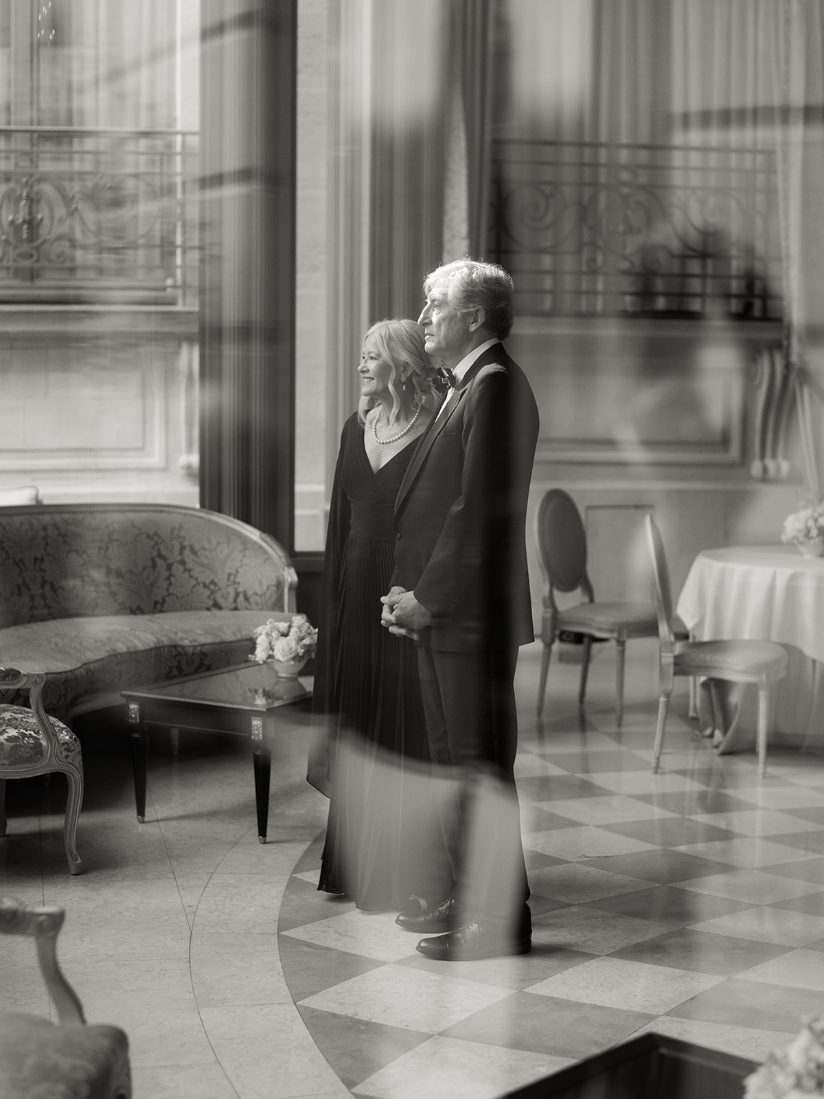 Parents sharing an emotional moment before a wedding ceremony in Paris