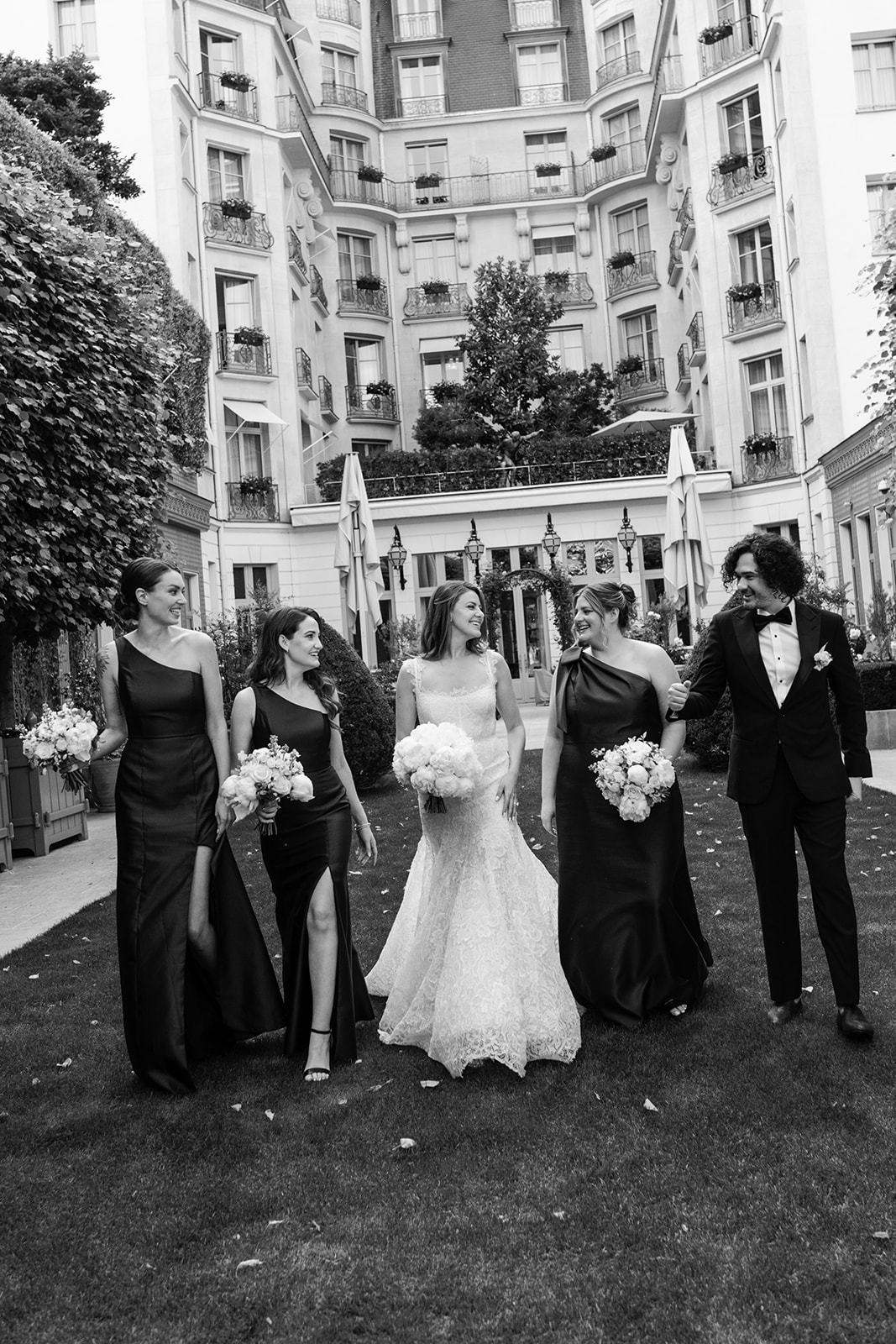 Black-and-white wedding party portrait on a Paris street