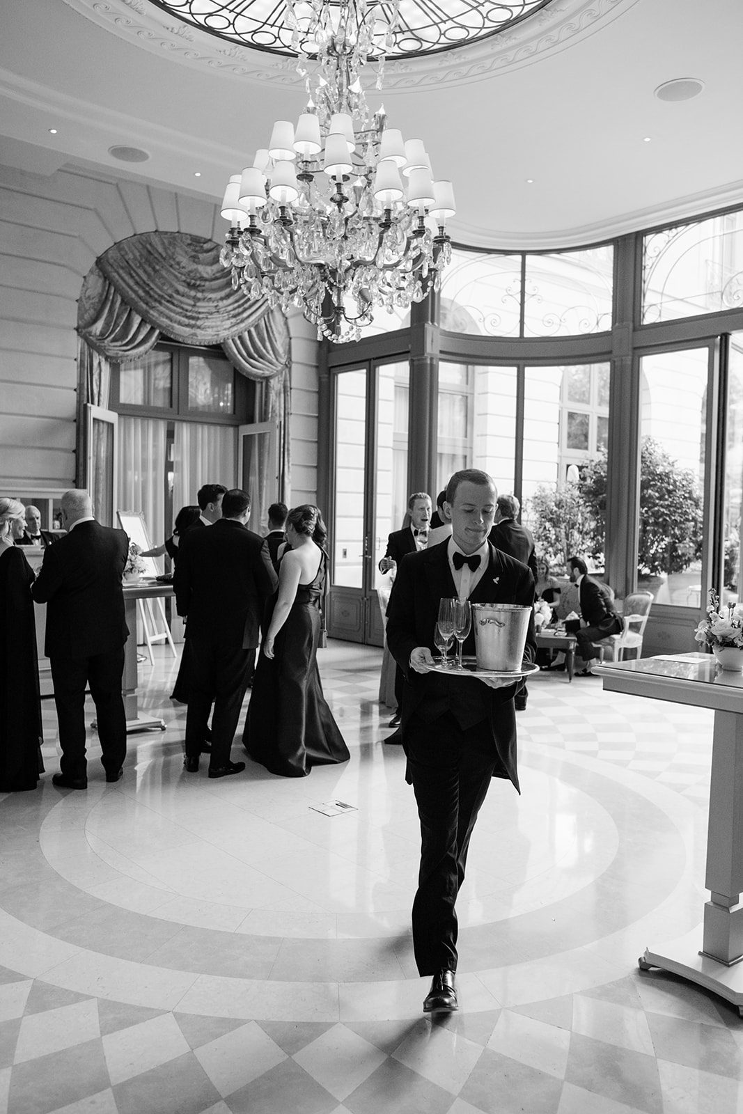 Black-and-white photograph of a wedding speech at the Ritz Paris reception