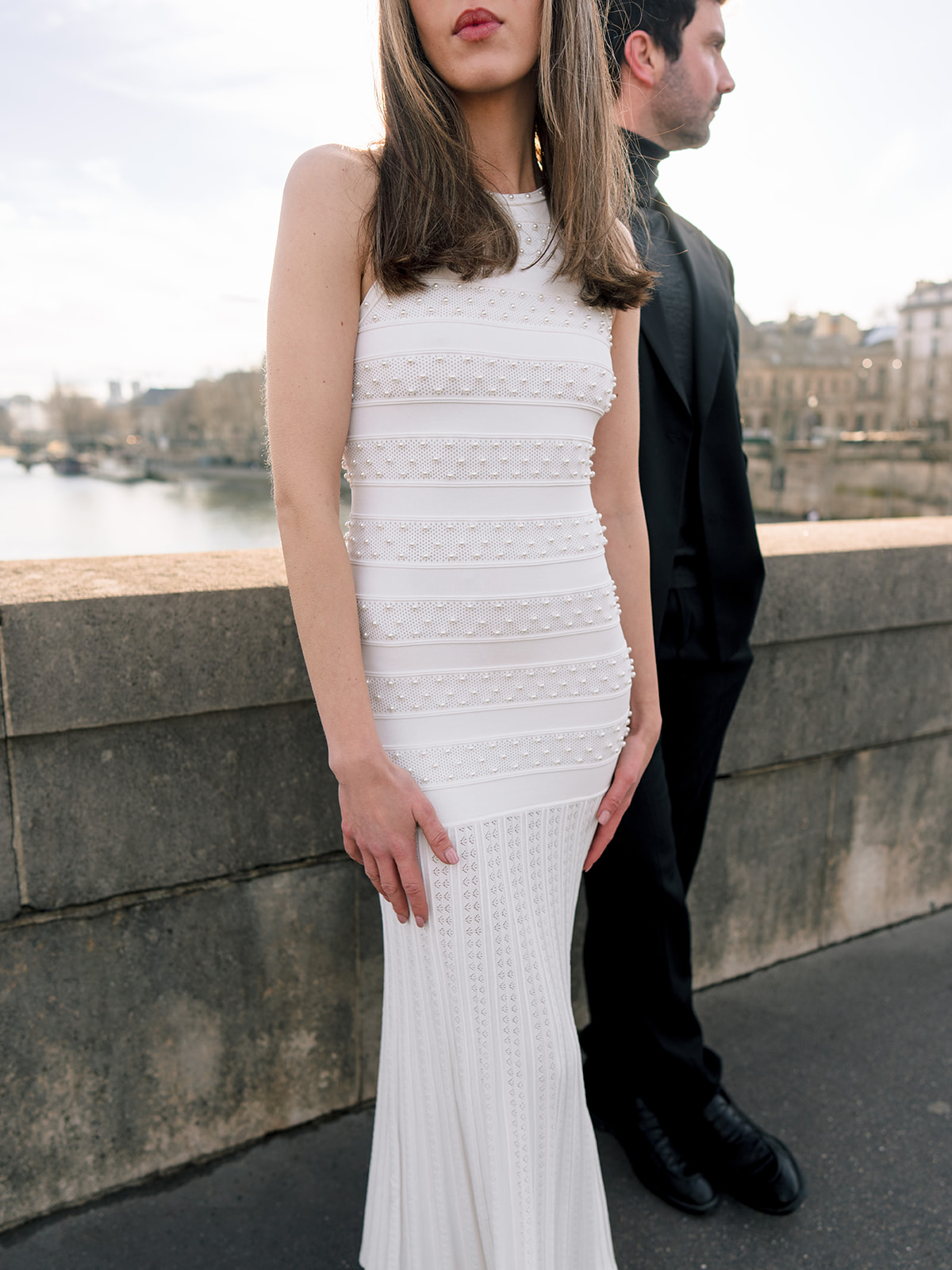 Editorial close-up portrait with natural backlight beside the Seine in Paris