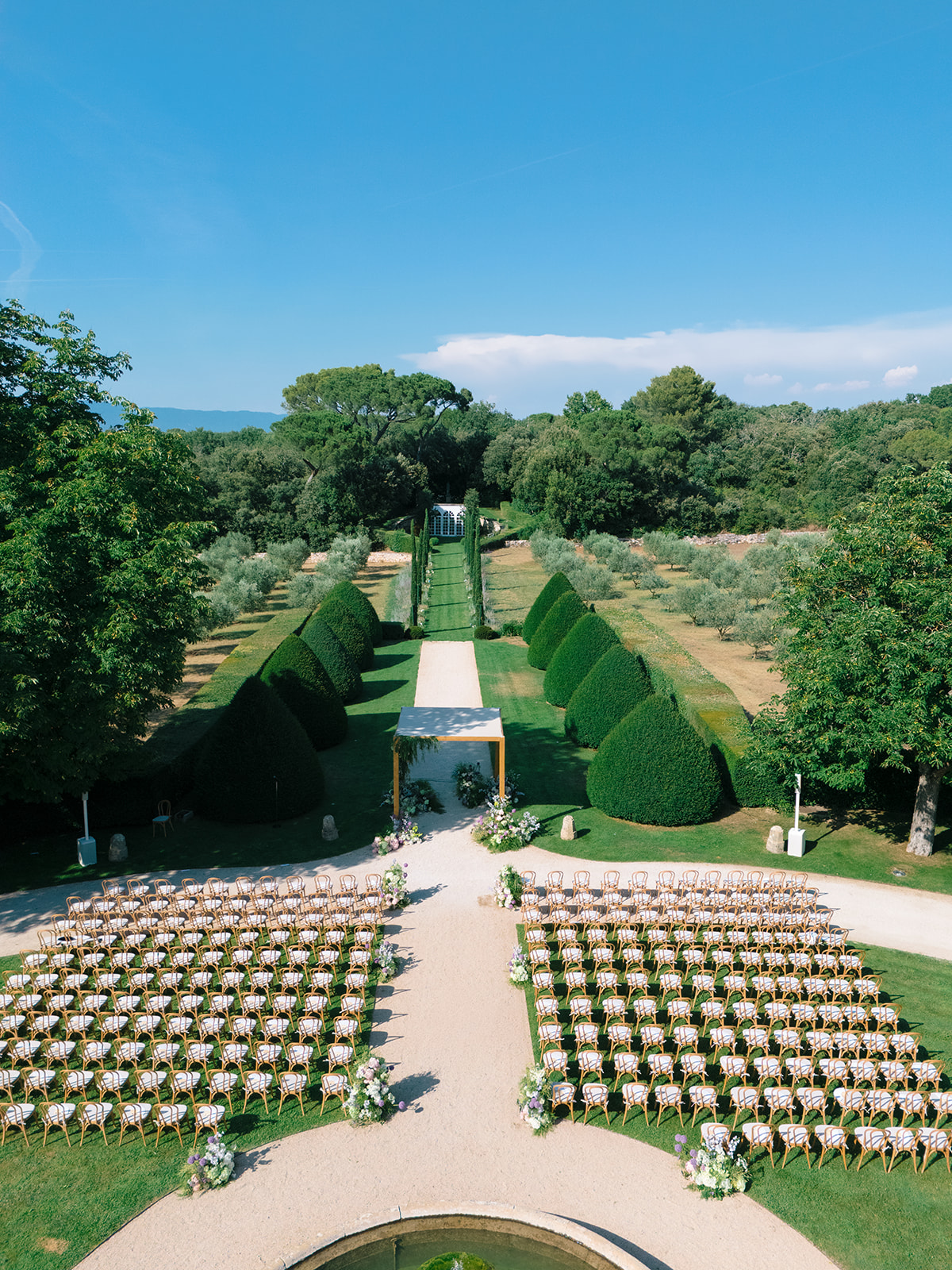 Outdoor wedding ceremony in the formal gardens of Villa Baulieu in Provence
