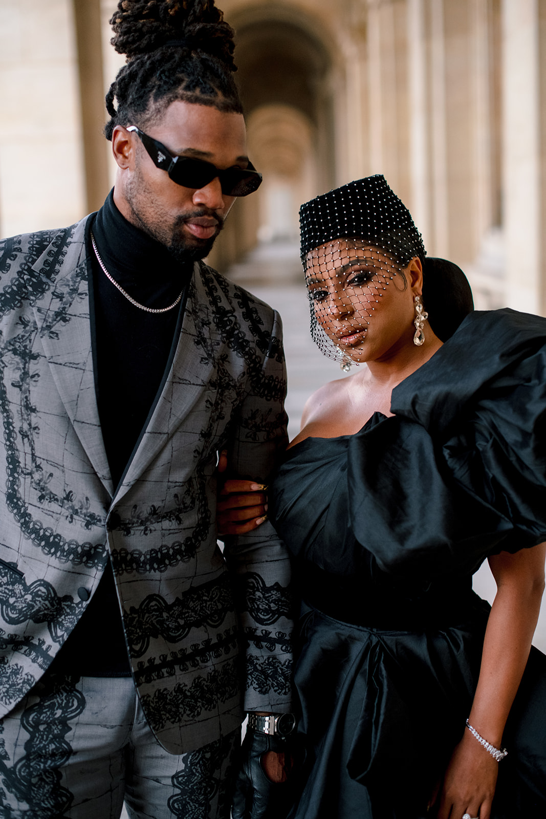 Close editorial portrait of Candice Craig and Omar Bolden in coordinated fashion looks