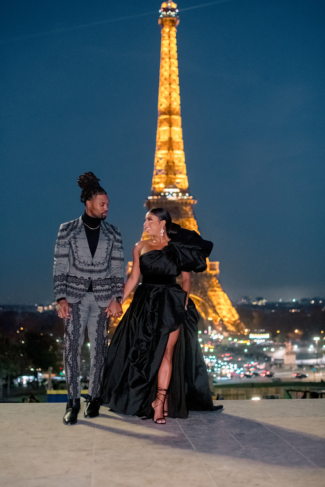 Candice Craig and Omar Bolden during an evening engagement portrait by the Eiffel Tower