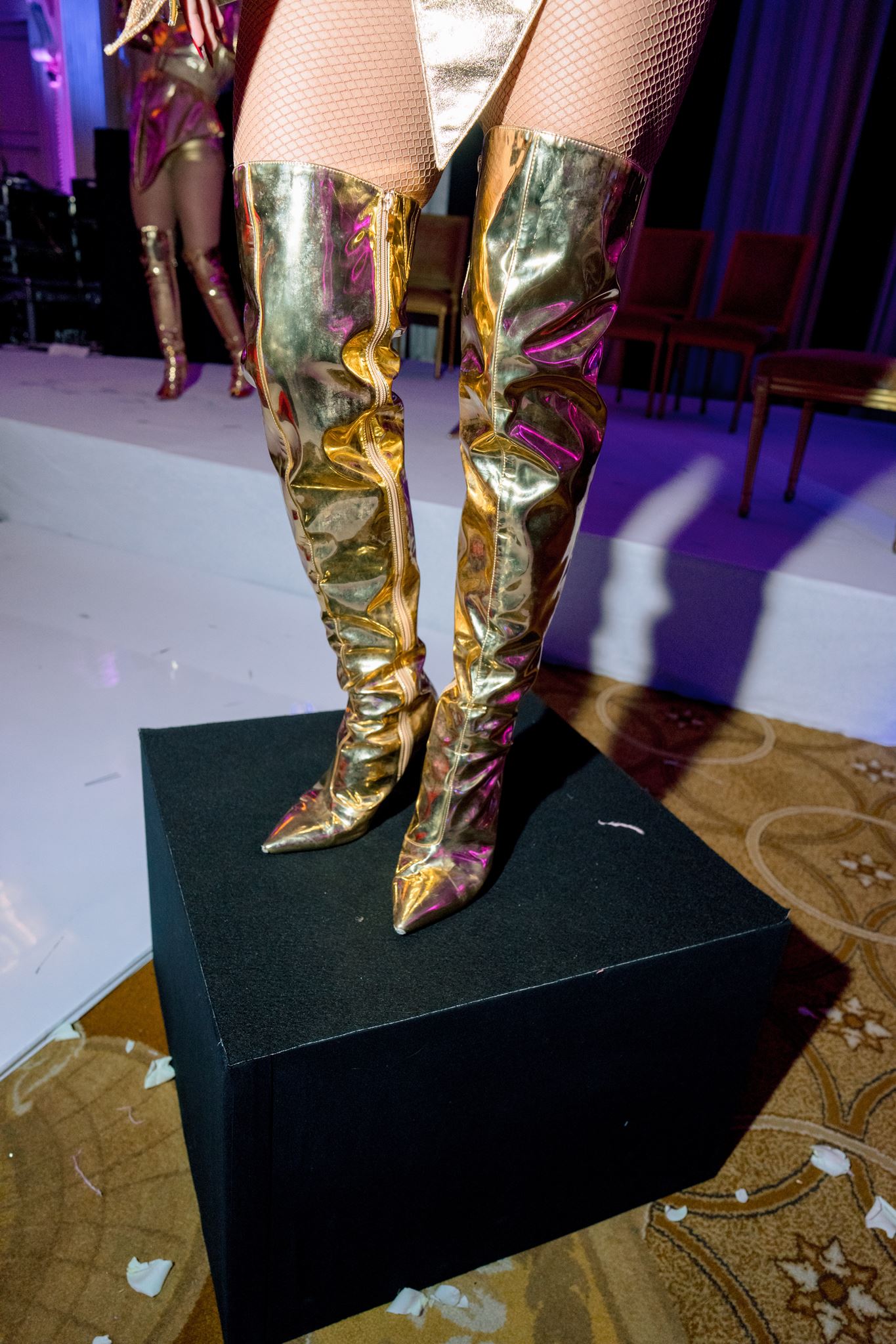 Gold statement boots from a dance performance at Shangri-La Paris