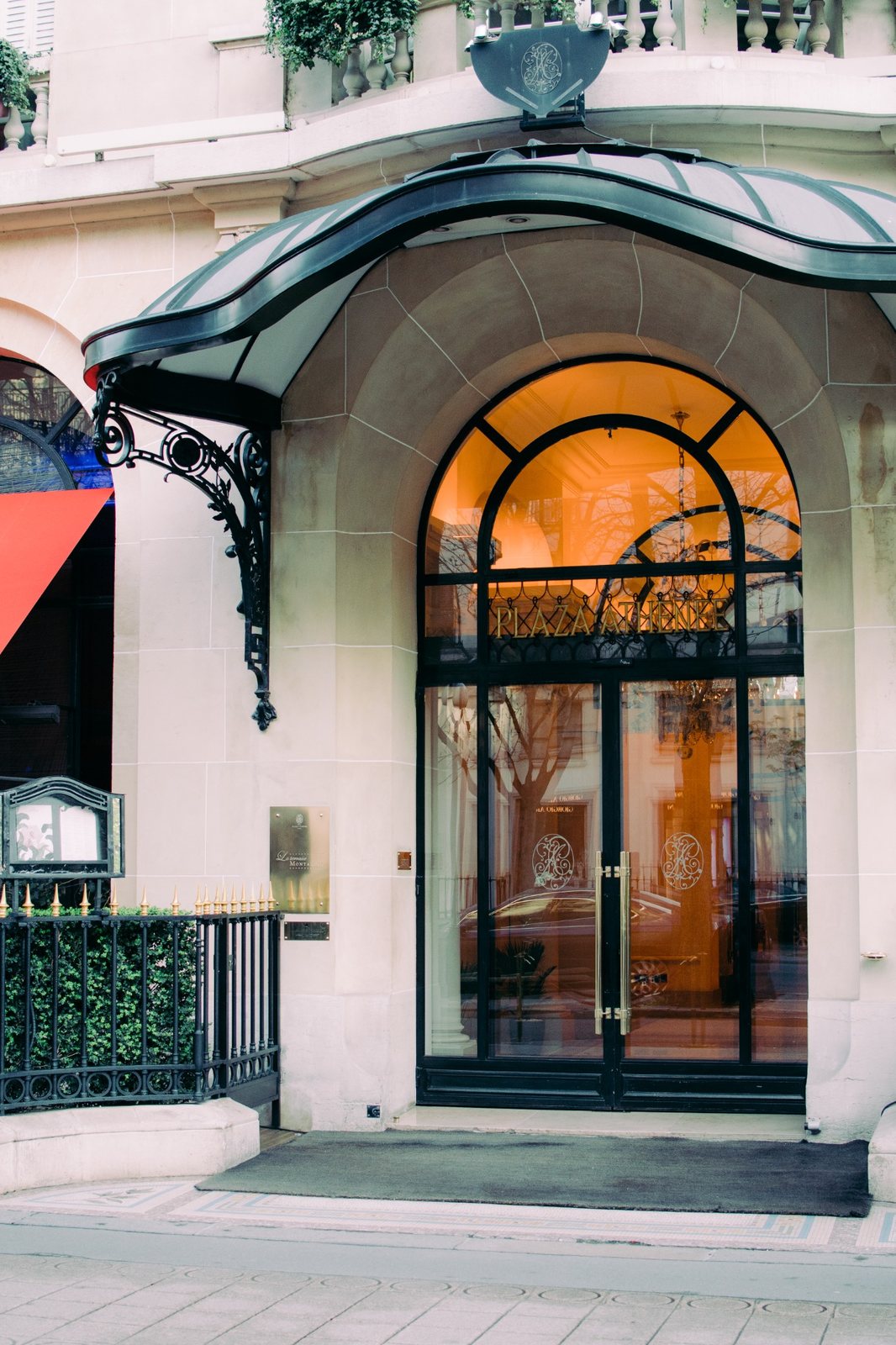 Main entrance of Hôtel Plaza Athénée at 25 Avenue Montaigne in Paris