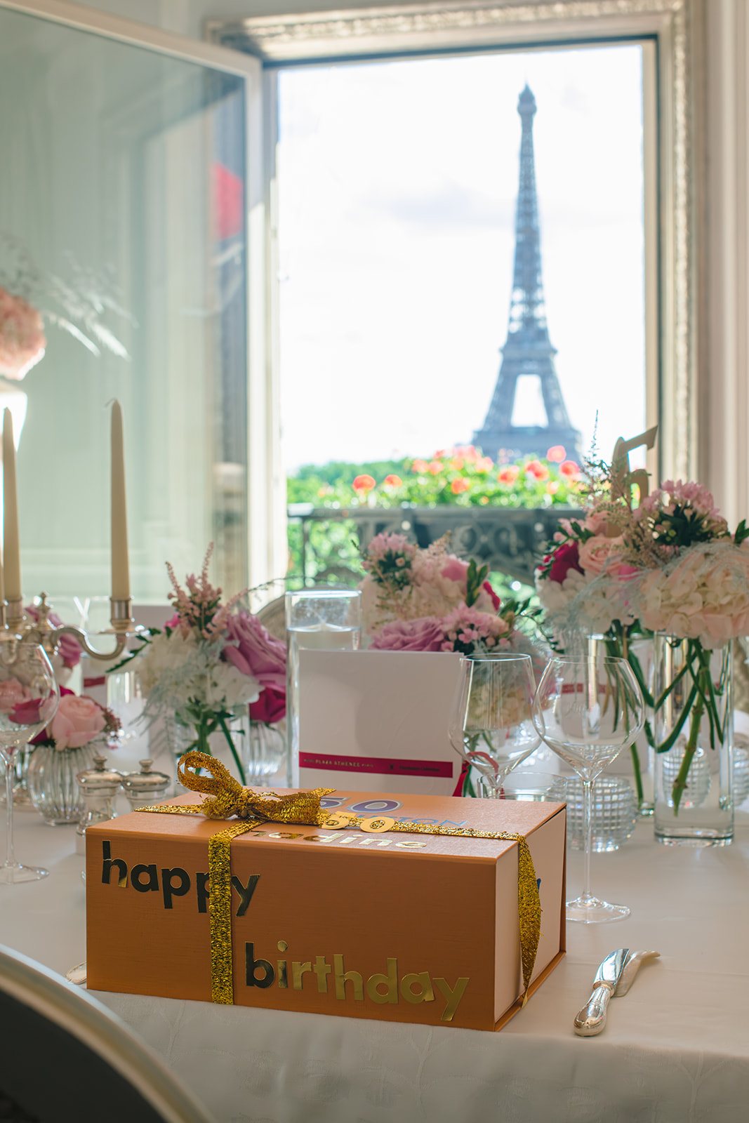 Table set for a private 50th birthday in the Haute Couture Suite at Hôtel Plaza Athénée with an Eiffel Tower view