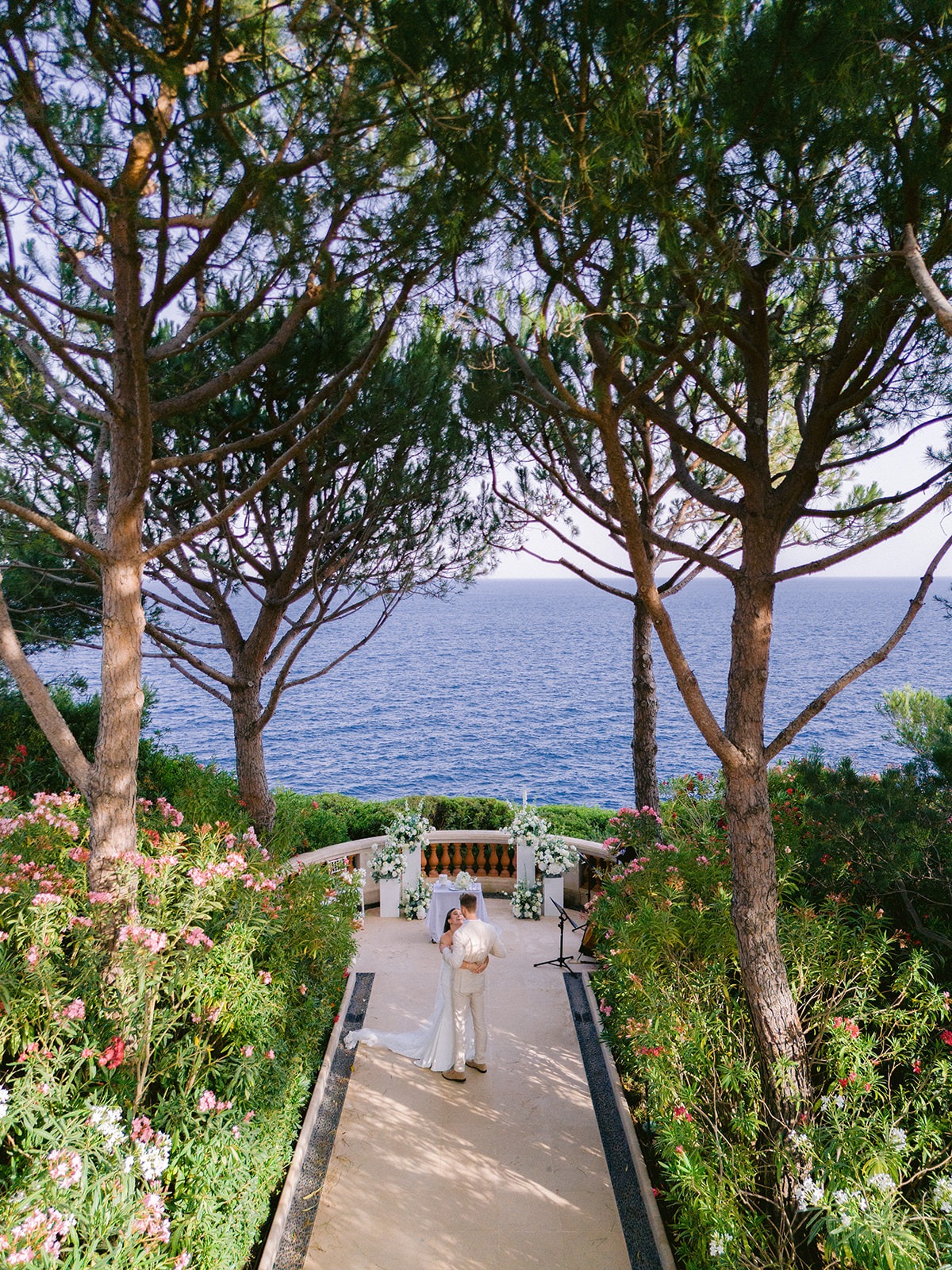 Drone view of a wedding couple near a sea-view ceremony setting at Cap-Ferrat