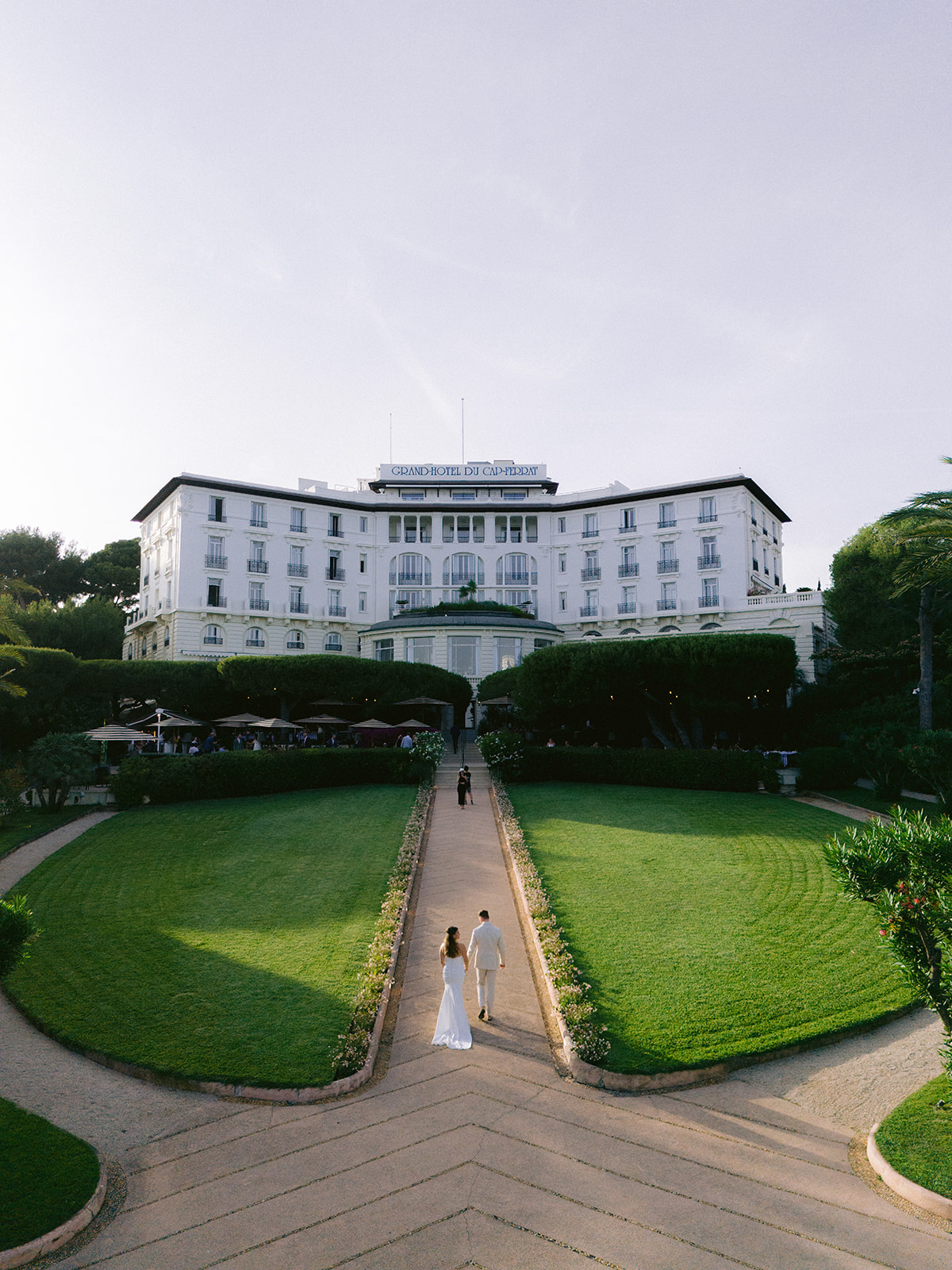 Bride and groom photographed in the formal gardens of Grand-Hôtel du Cap-Ferrat