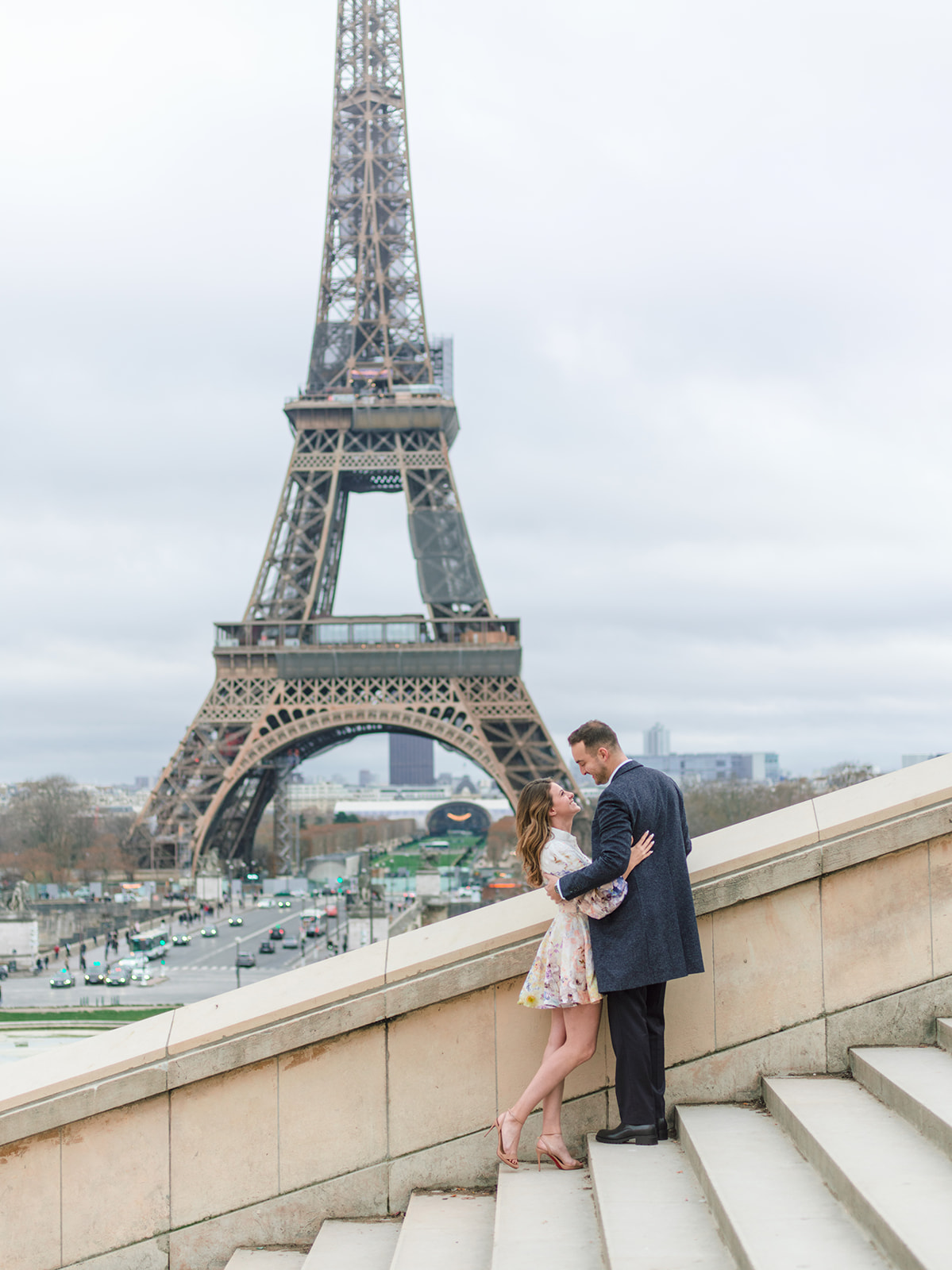 American couple photographed on the Trocadéro steps with the Eiffel Tower