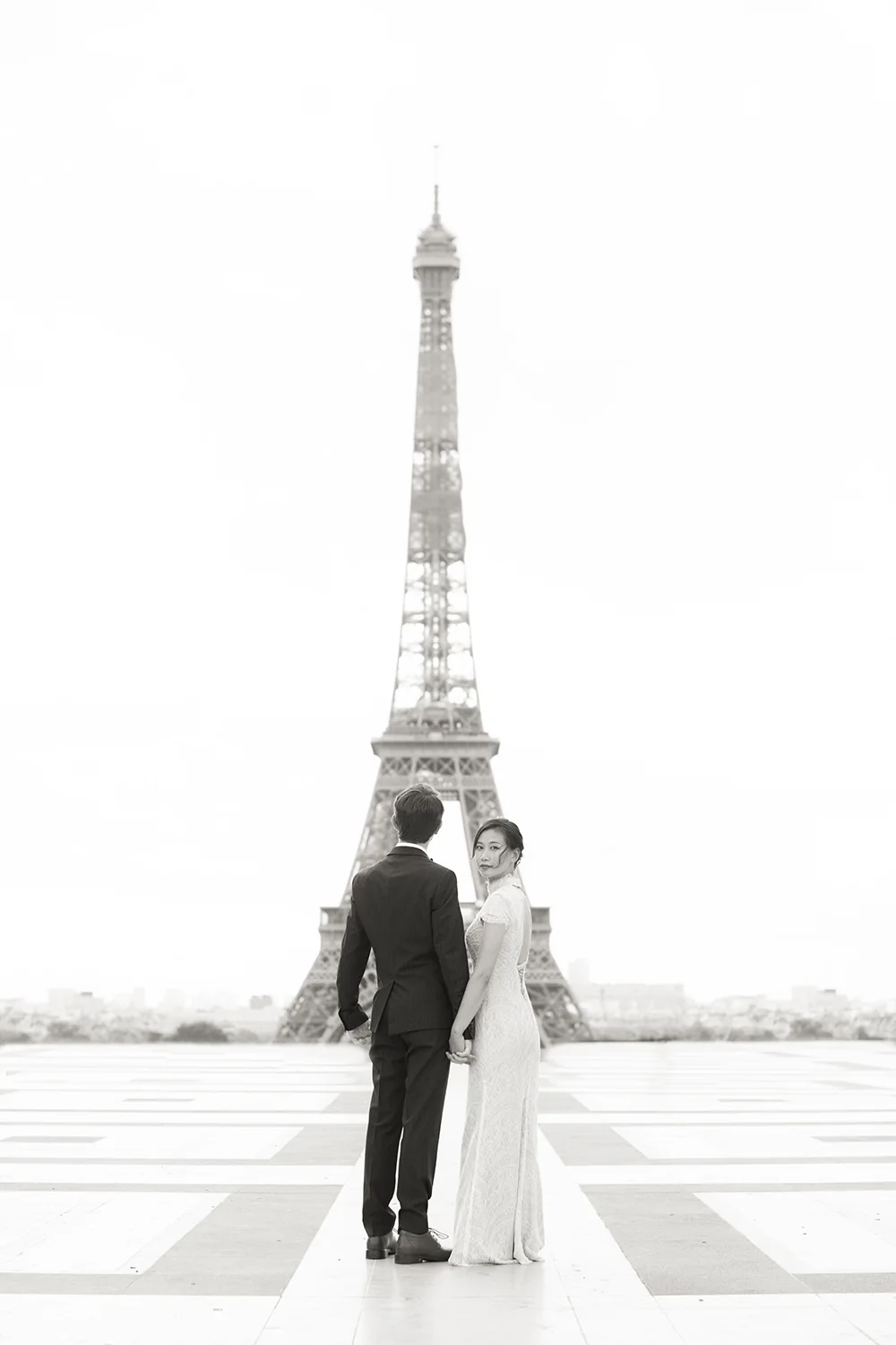 Black and white couple portrait near the Eiffel Tower in Paris