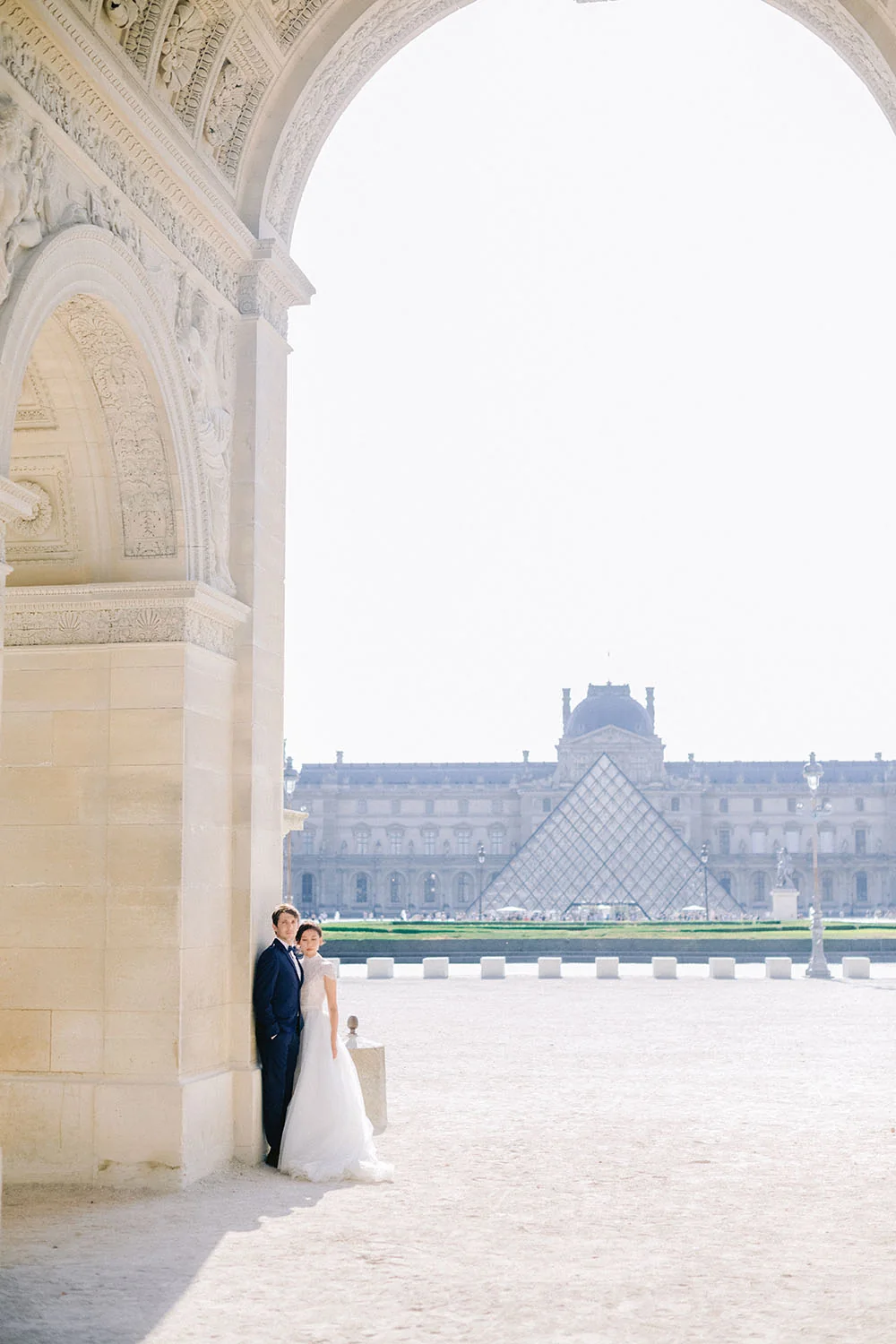 Bride and groom at the Louvre during their Paris pre-wedding session