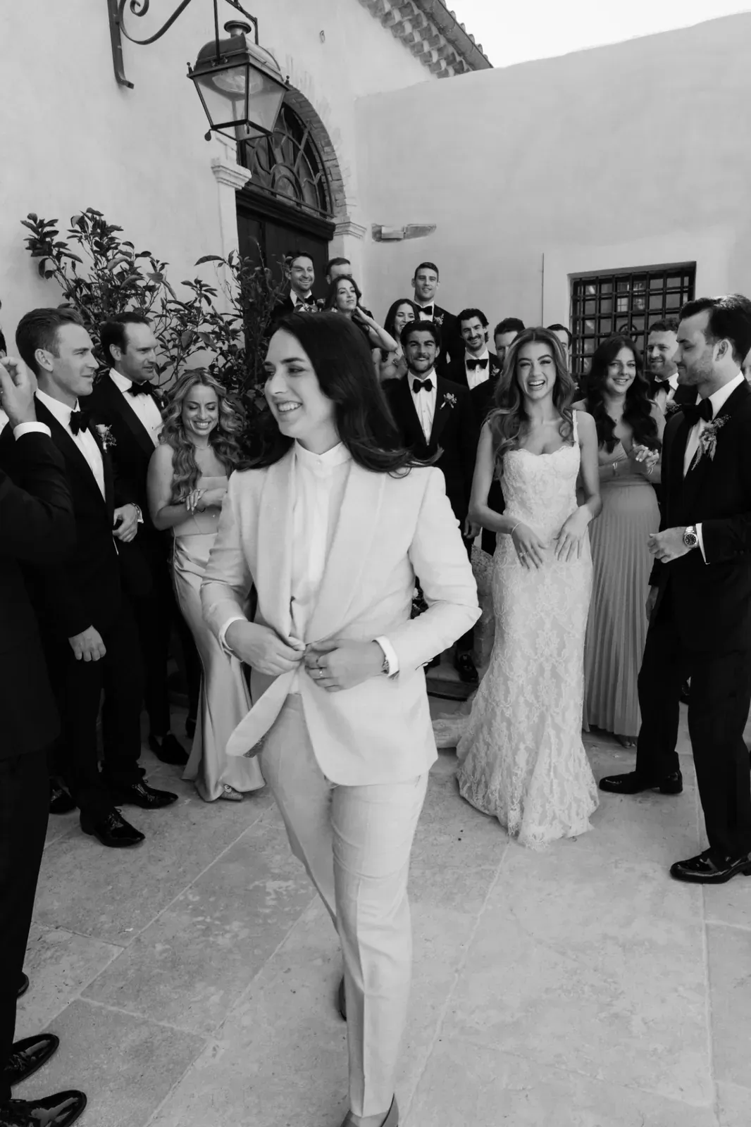 Candid black and white moment with the bride and wedding party at Villa Baulieu