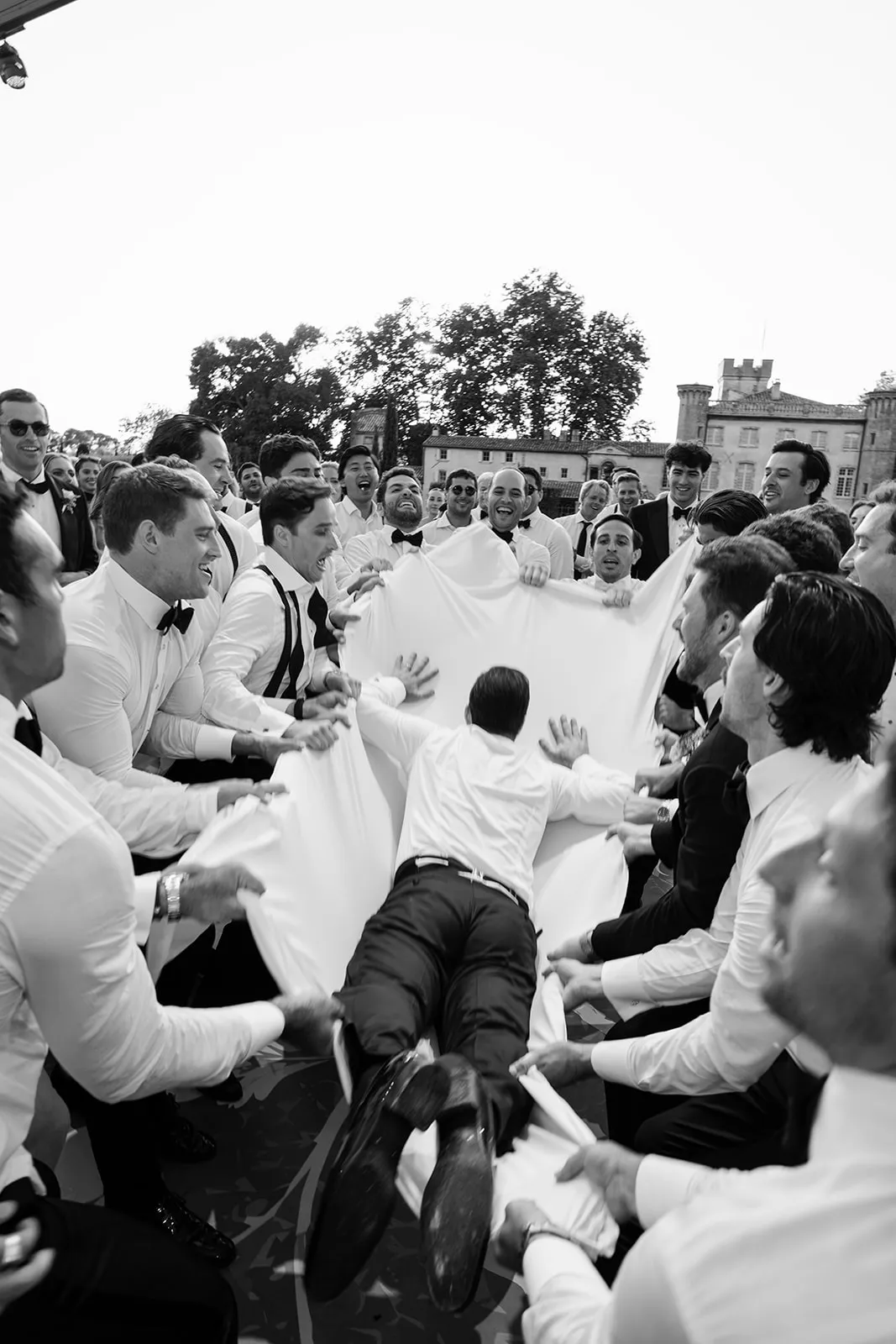 Groom crowd surfing during the hora at Villa Baulieu