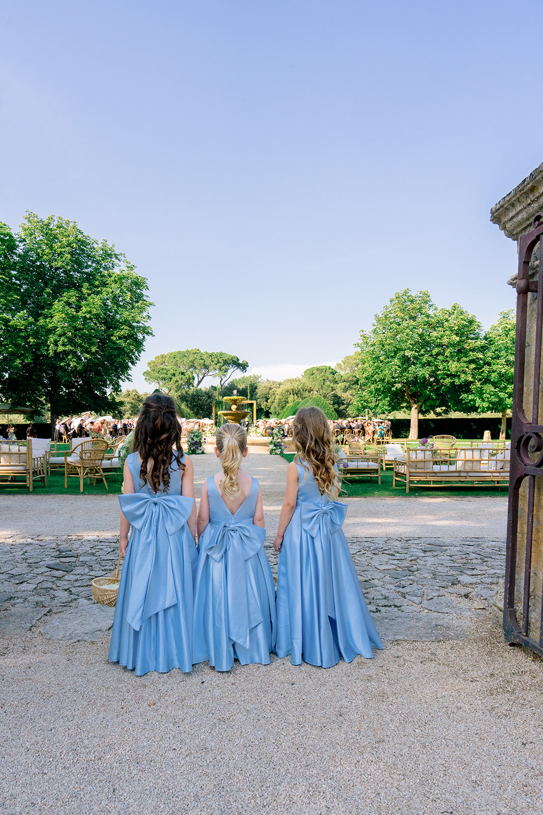 Bride arriving for an outdoor wedding ceremony at a Provence château