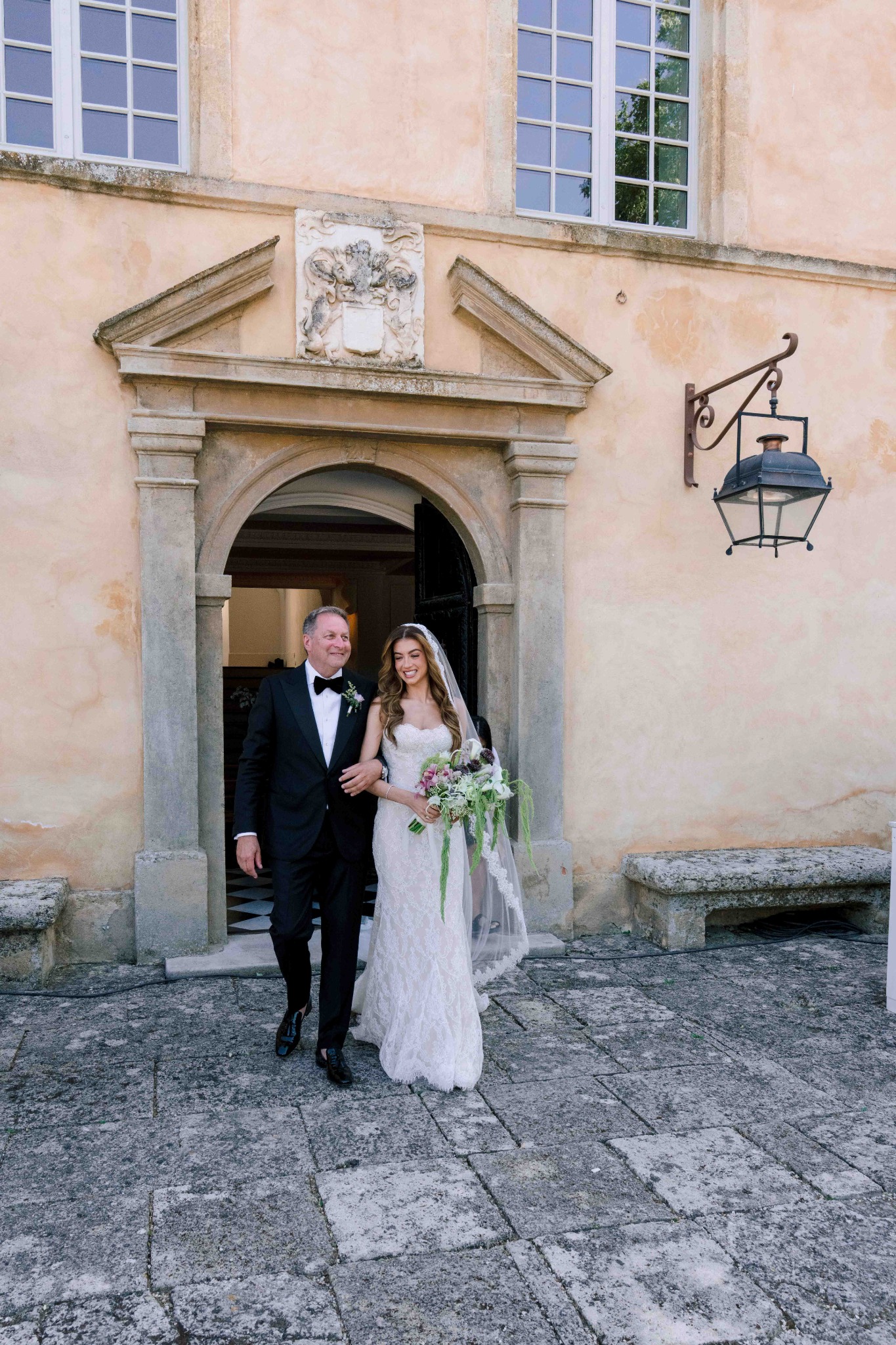 Bride walking down the aisle during an outdoor Provence wedding ceremony