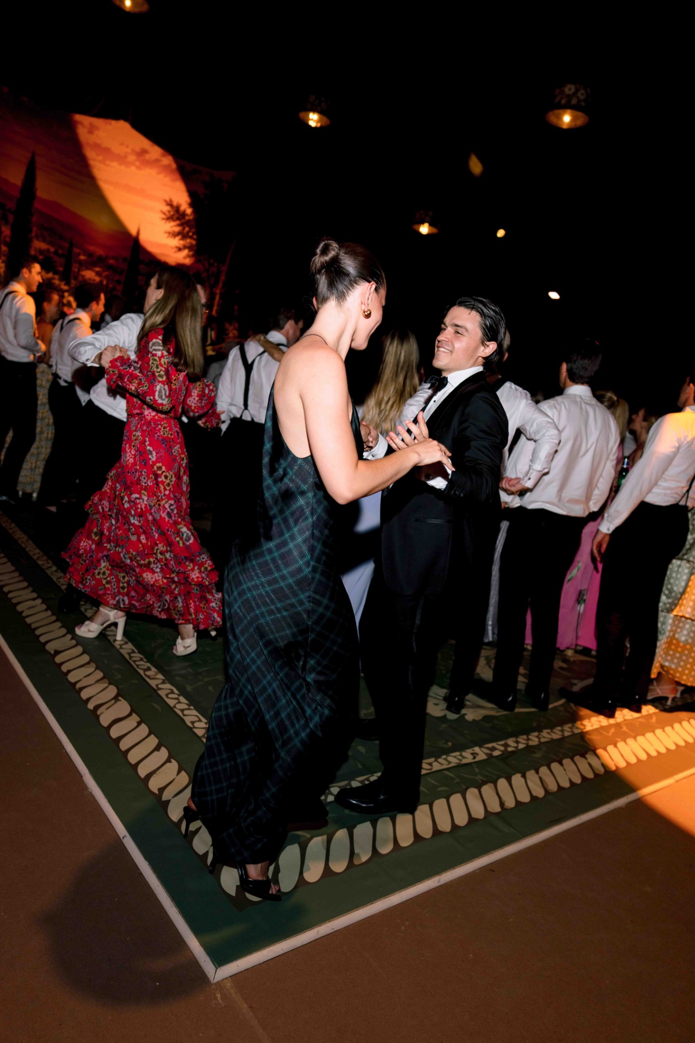 Wedding guests dancing during the reception at Villa Baulieu
