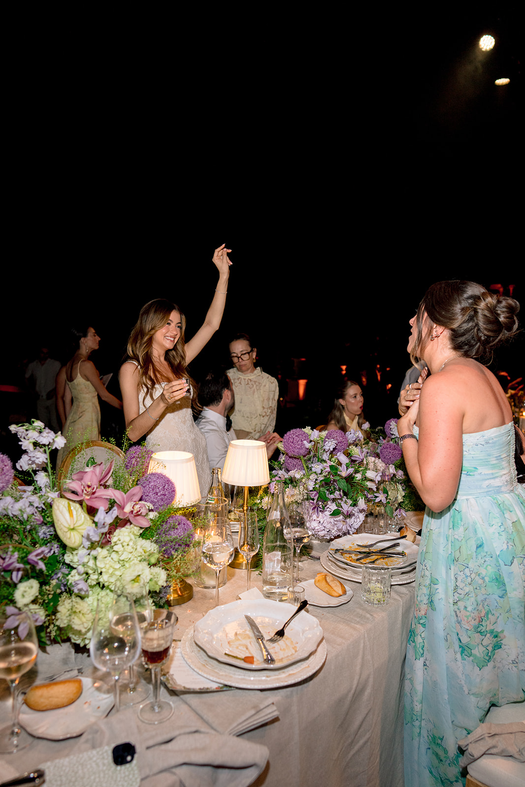 Bride celebrating with guests during the evening reception at Villa Baulieu