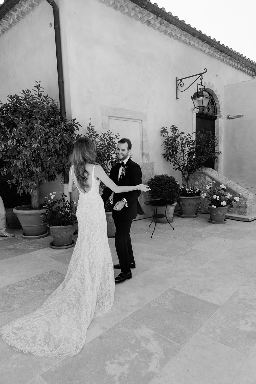 Bride and groom during their first look at Villa Baulieu