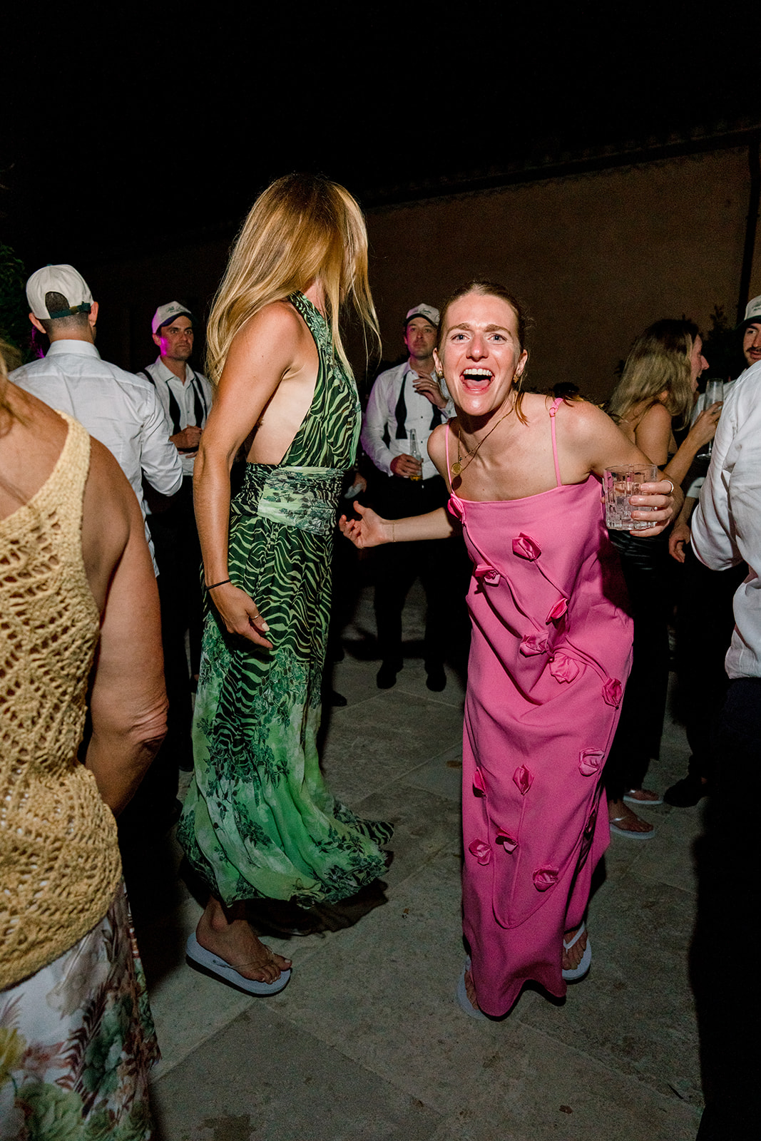 Wedding guest in a pink dress enjoying the Villa Baulieu party