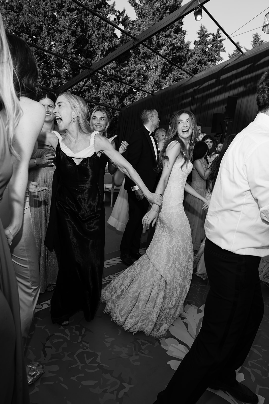 Bride dancing in black and white during the Villa Baulieu reception