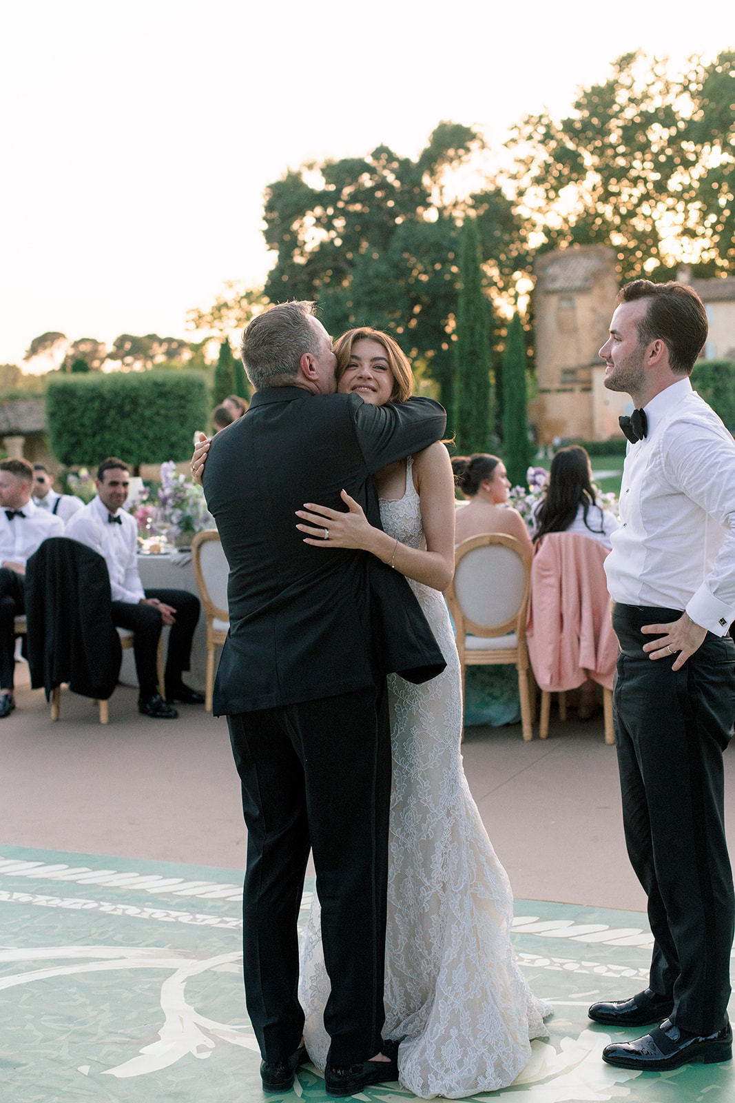 Bride embracing a guest during the Villa Baulieu reception