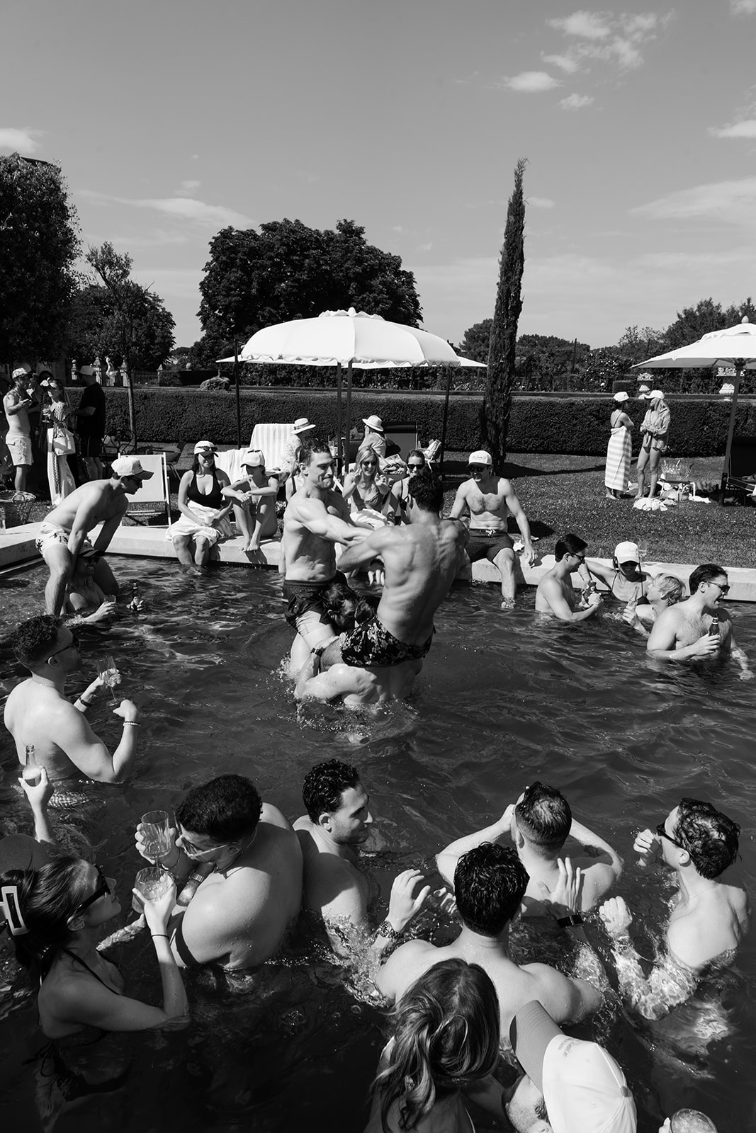 Pool party guests photographed in black and white at Villa Baulieu in Provence