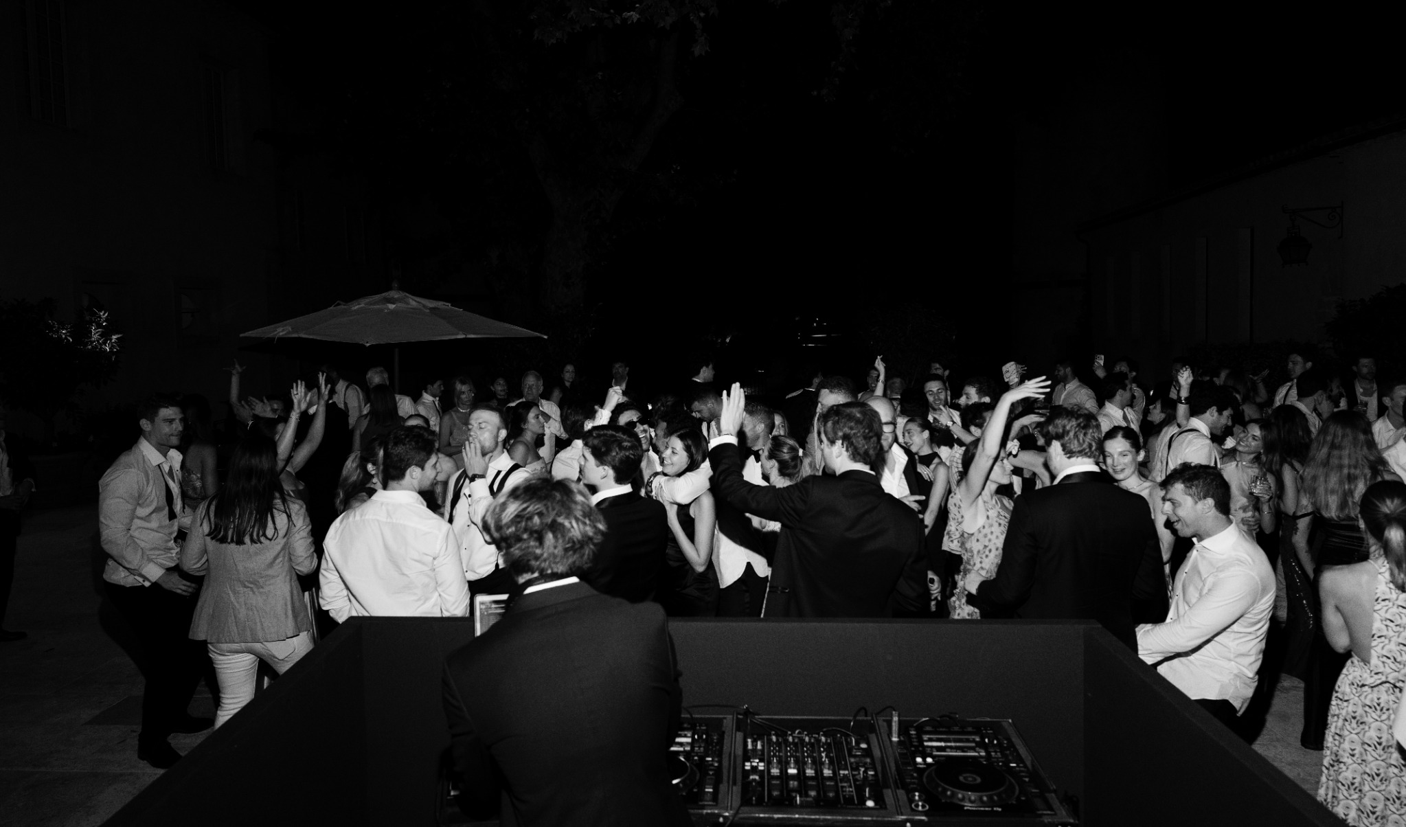 An outdoor party, terrace or pool event after dark.