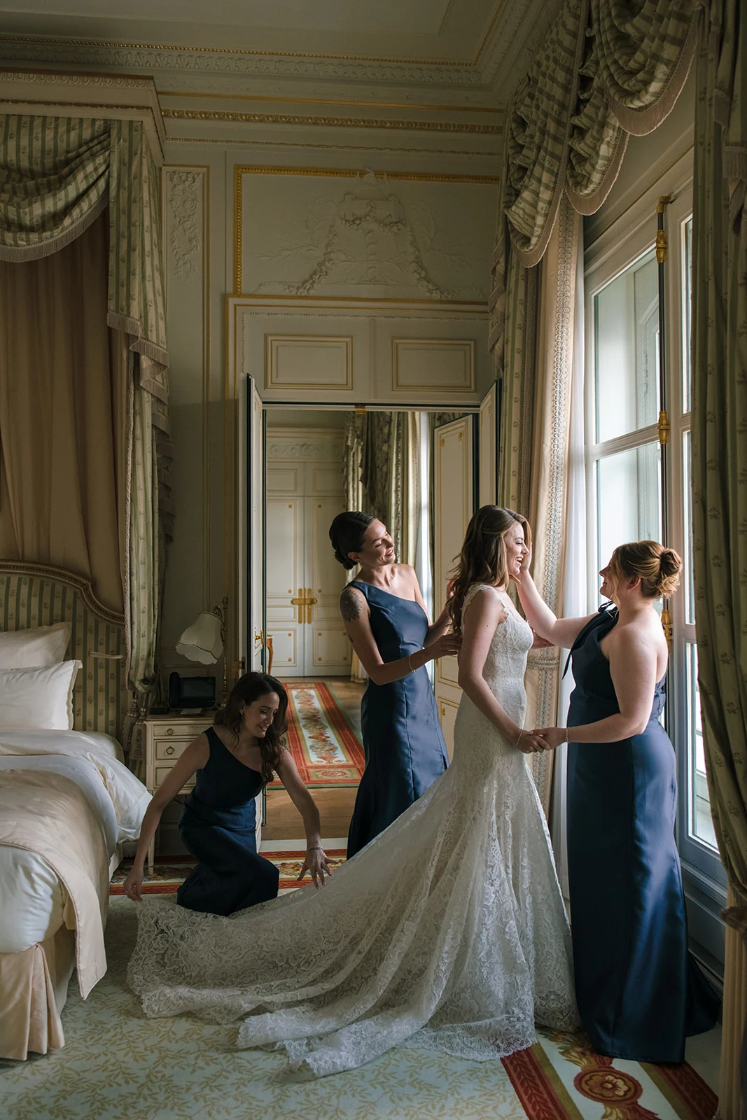 Editorial photograph of the bride and bridesmaids in a Ritz Paris suite