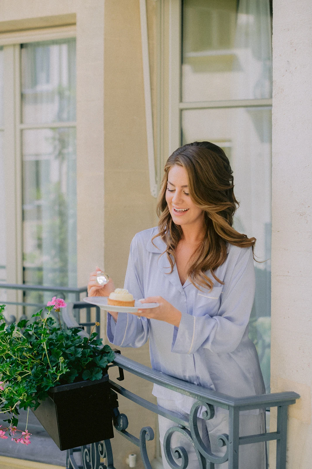 Bride enjoying a quiet getting-ready moment on a luxury hotel balcony in Paris