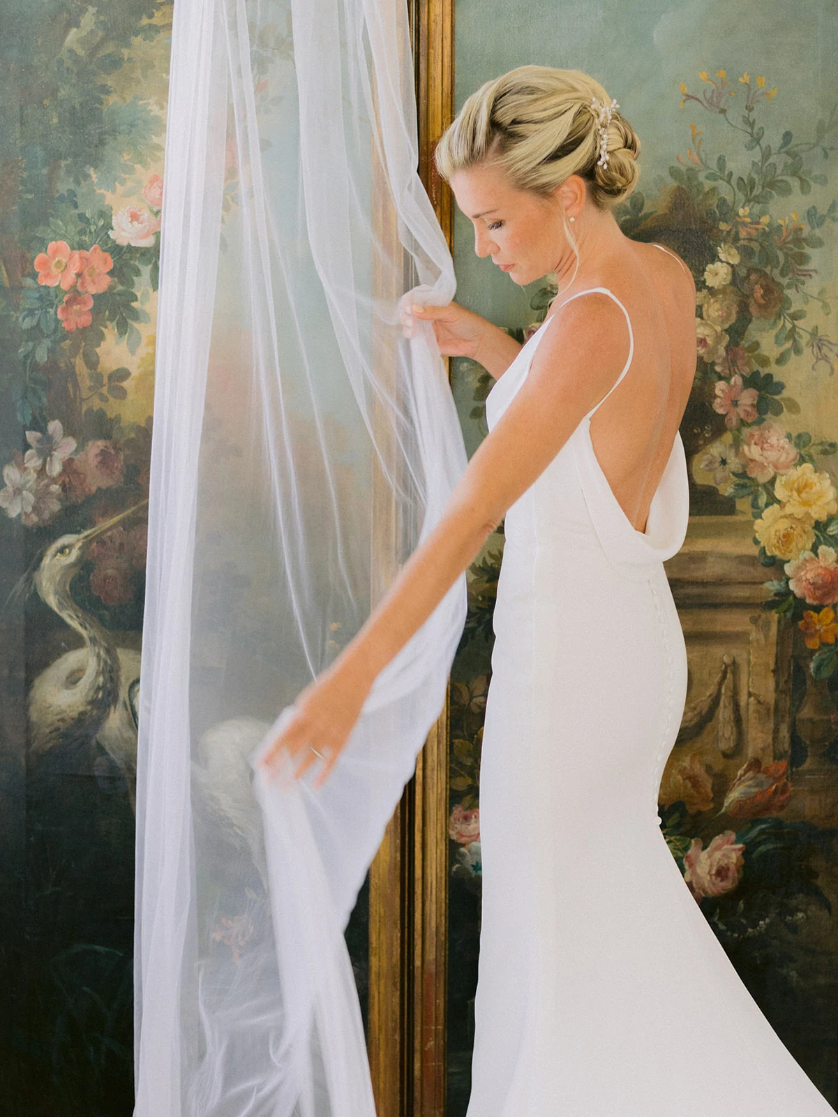 Bride adjusting her wedding dress before the ceremony