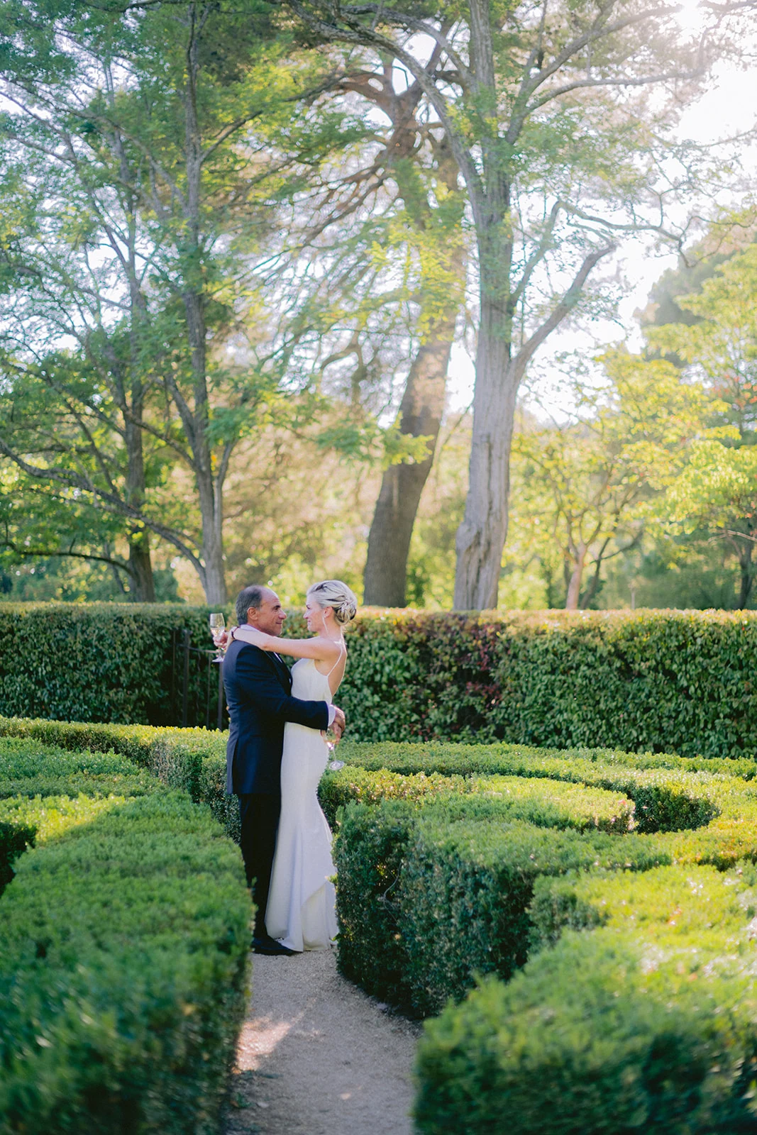 Bride and groom sharing a first dance in the gardens of Château de la Gaude