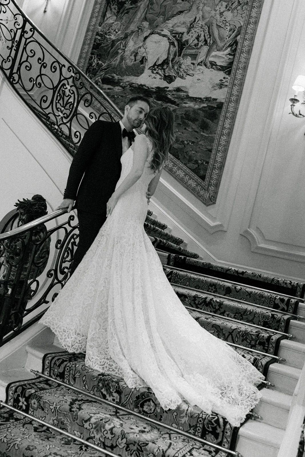 Editorial bridal portrait on the grand staircase at the Ritz Paris