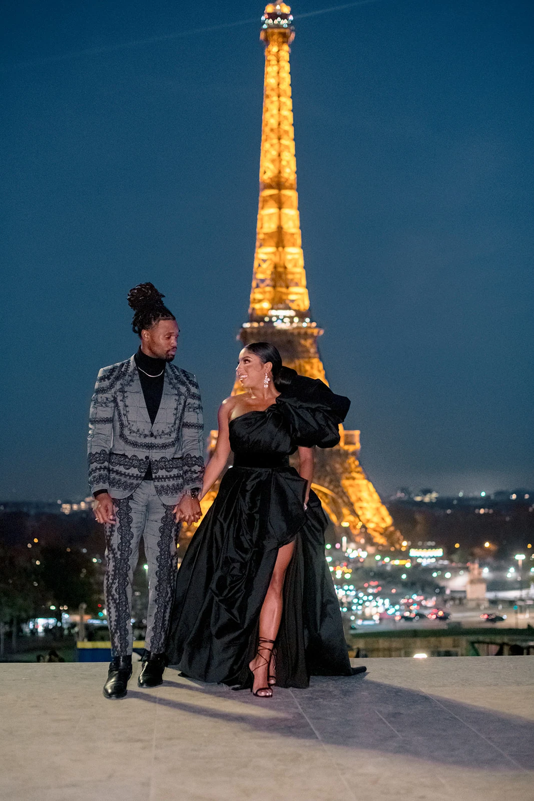 Candice Craig and Omar Bolden during an evening engagement portrait by the Eiffel Tower