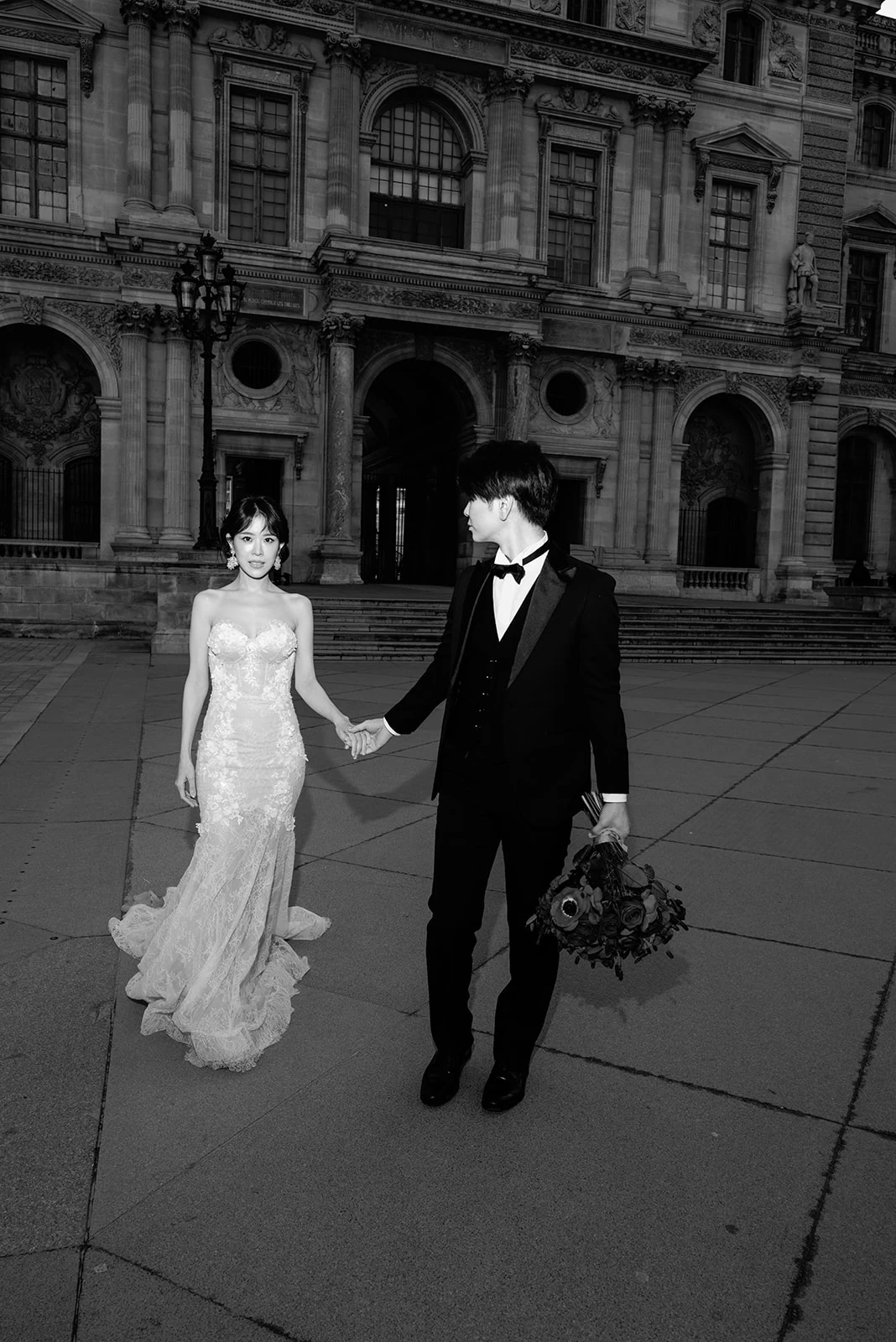 Bride and groom photographed on the marble staircase at Shangri-La Paris