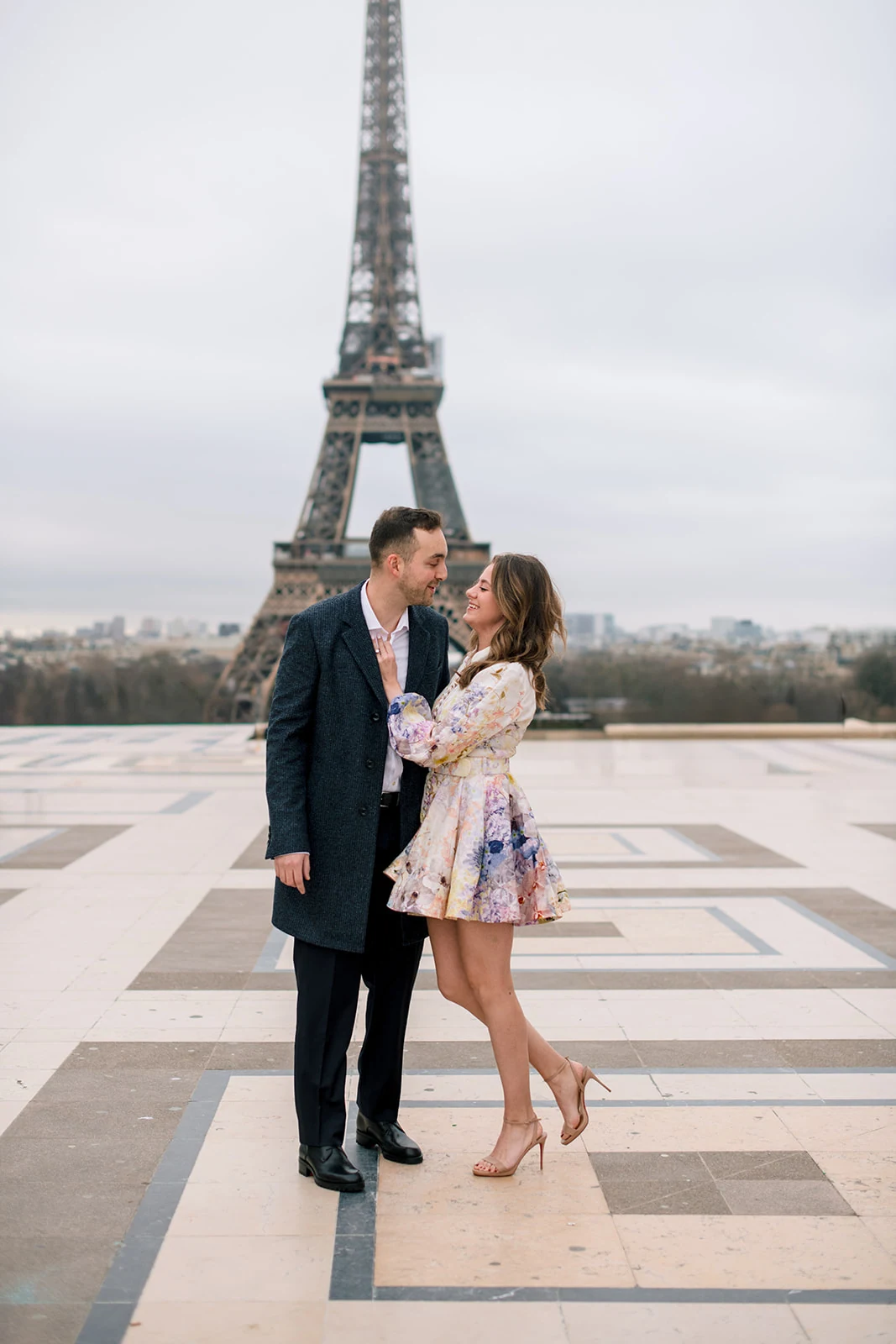 American couple photographed at the Eiffel Tower before their wedding in Switzerland