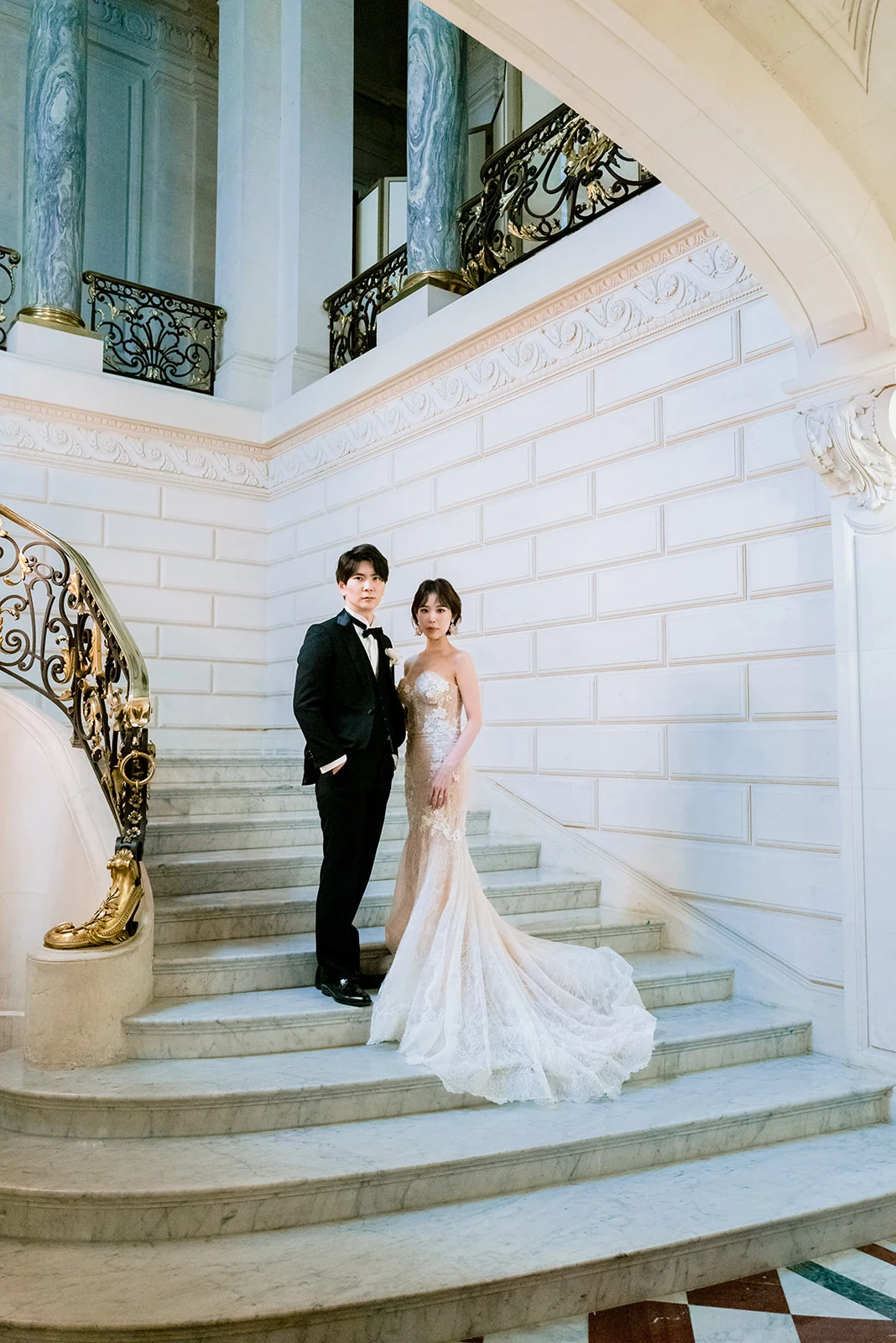 Editorial bridal portrait with lace wedding dress and bouquet in Paris