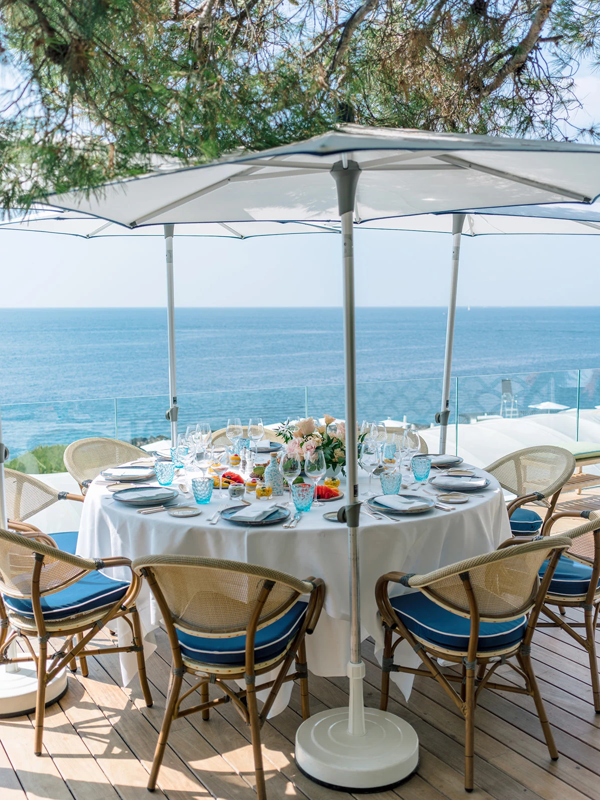 Sea-view terrace set for a wedding pool party lunch on the French Riviera