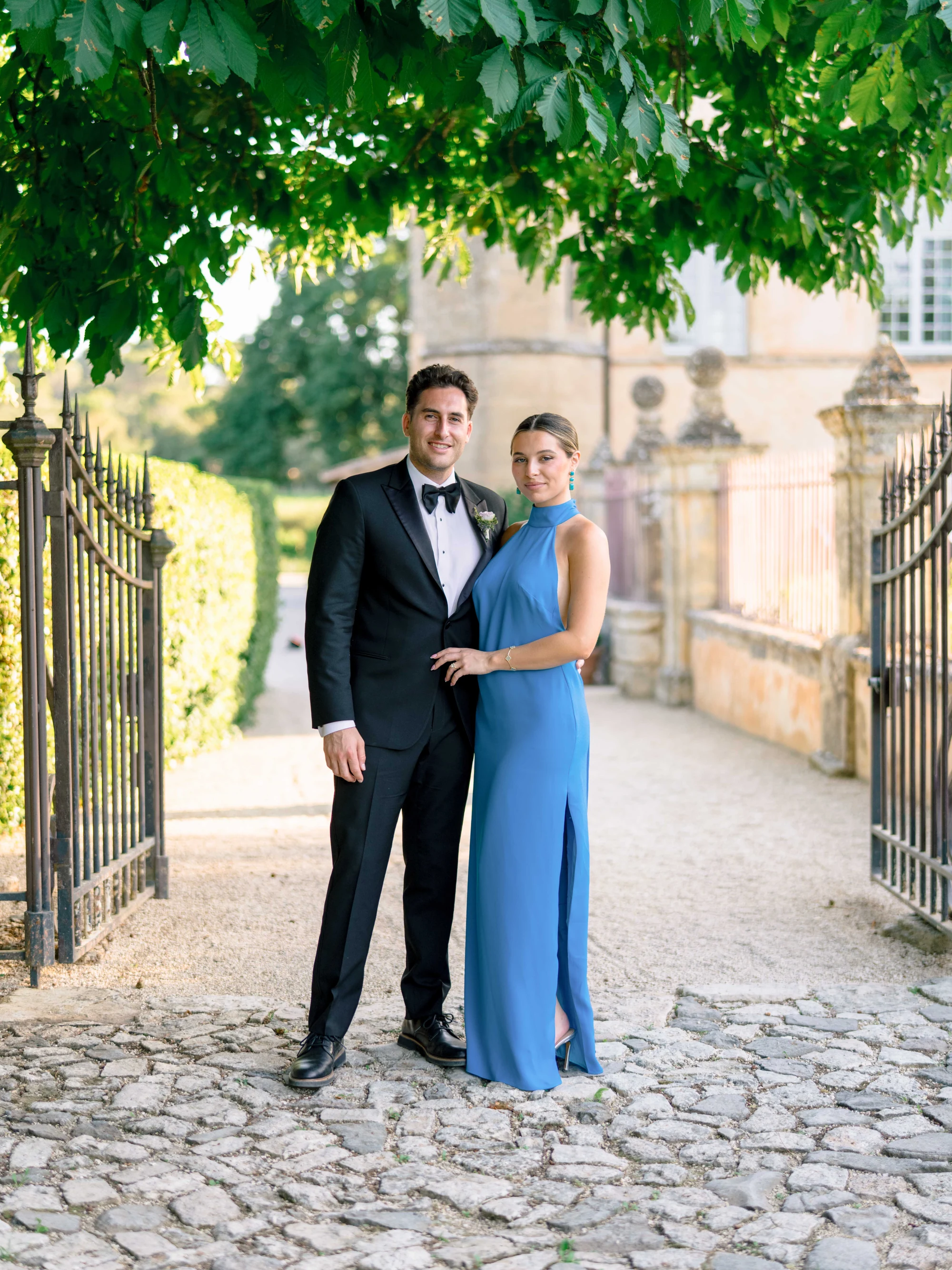 Wedding guests posing for a group photograph at Villa Baulieu